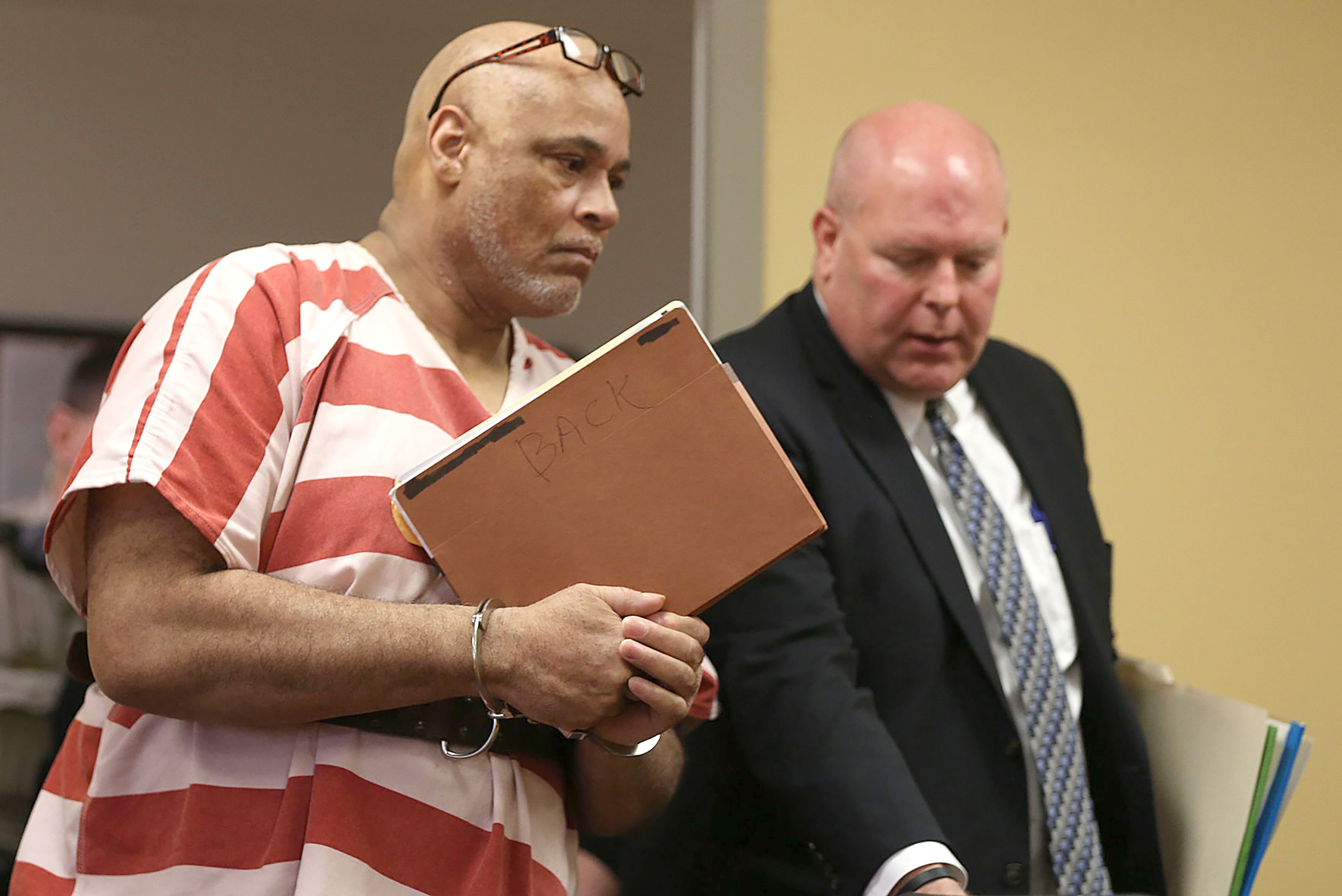 Lawyers: Iowa public defender's side police job is conflict