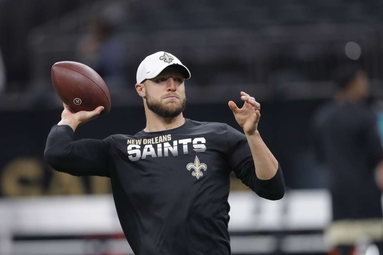 New Orleans Saints quarterback Taysom Hill warms up before an NFL preseason football game in New Orleans, Thursday, Aug. 29, 2019. (AP Photo/Bill Feig)