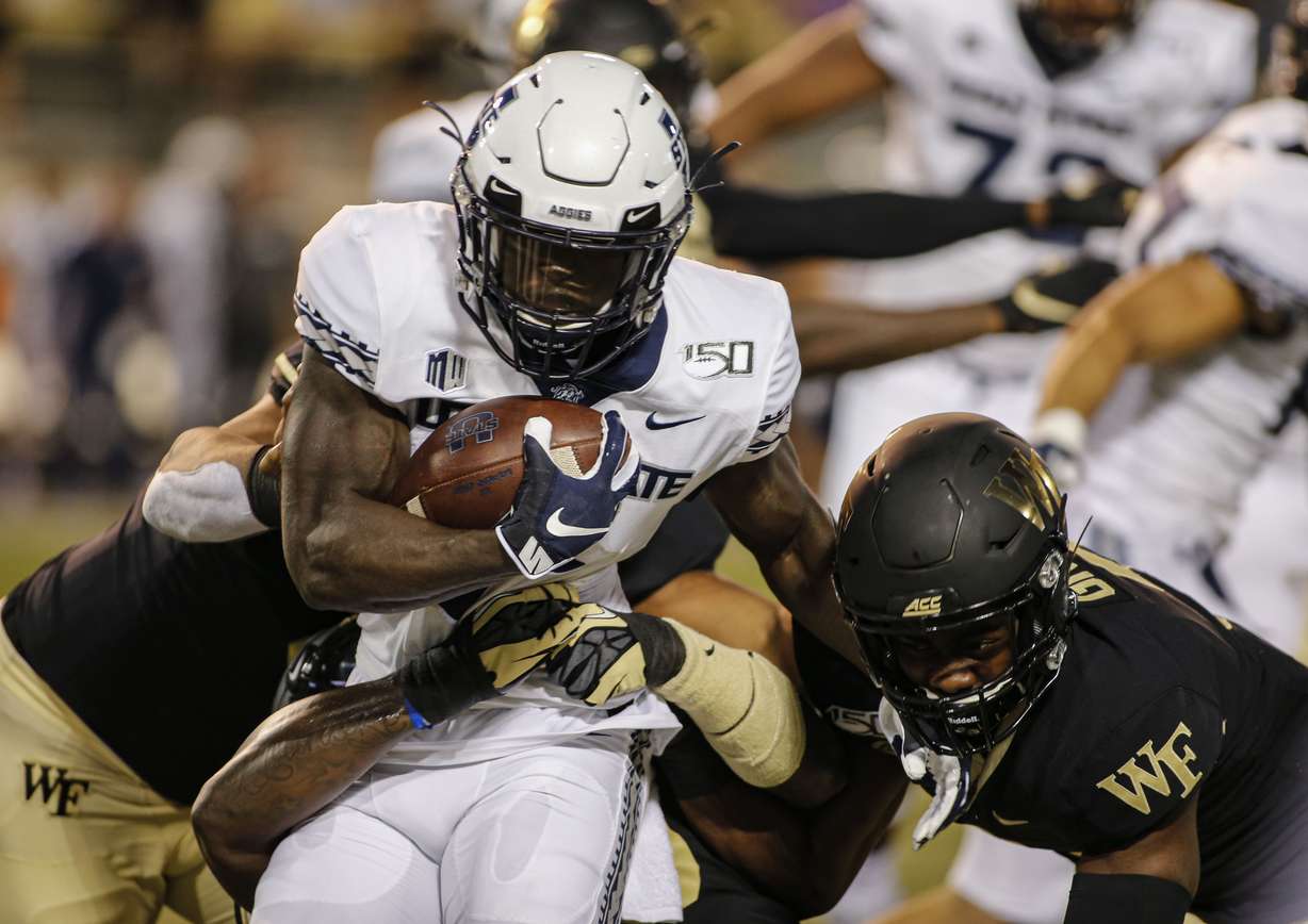 Utah State running back Gerold Bright carries the ball against Wake Forest. Photo: Nell Redmond, AP Photo