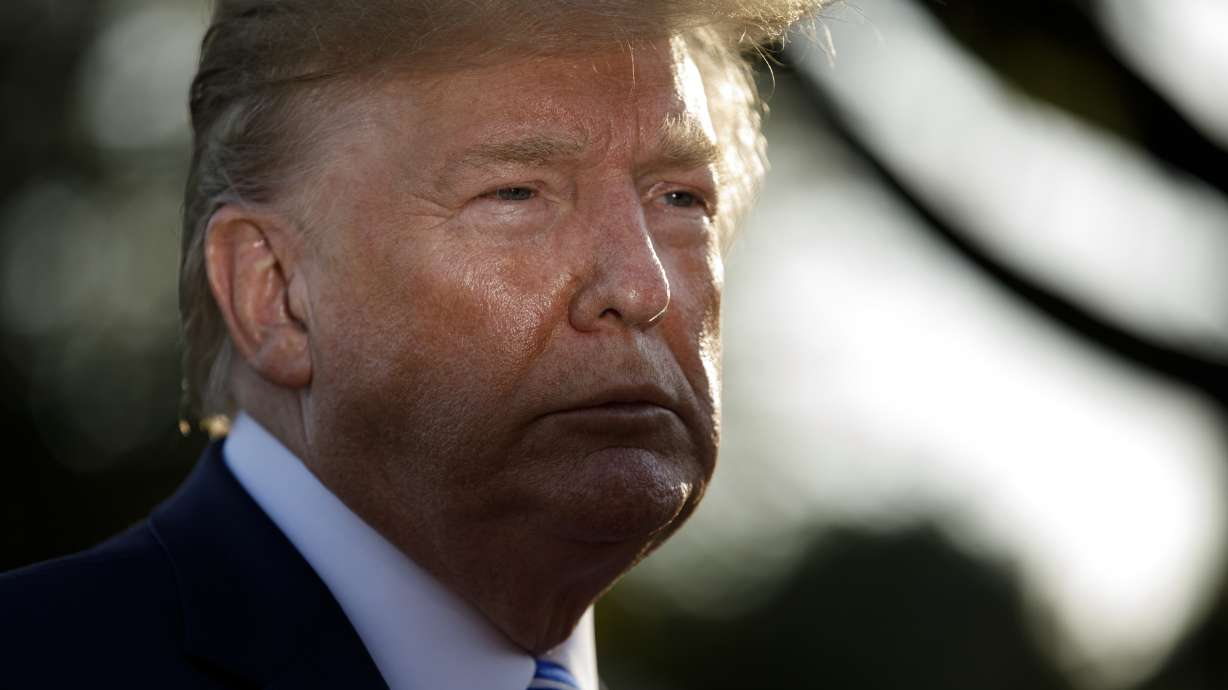 Trump at golf club after going to Camp David to track storm