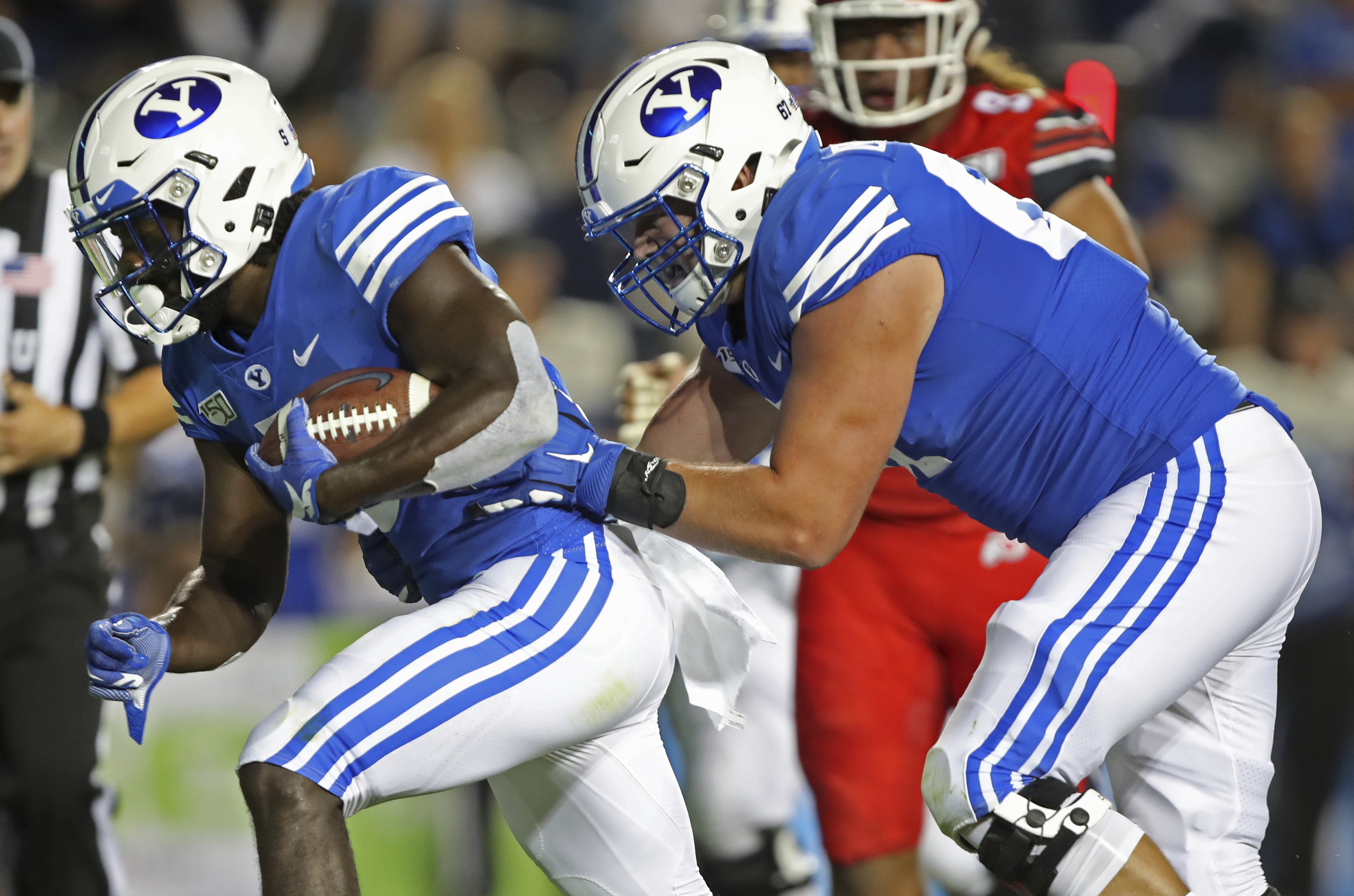 BYU offensive lineman Brady Christensen, right, pushes in running back Ty'Son Williams, left, for a touchdown in the second half during an NCAA college football game, Thursday, Aug. 29, 2019, in Provo, Utah. (Photo: George Frey, AP)