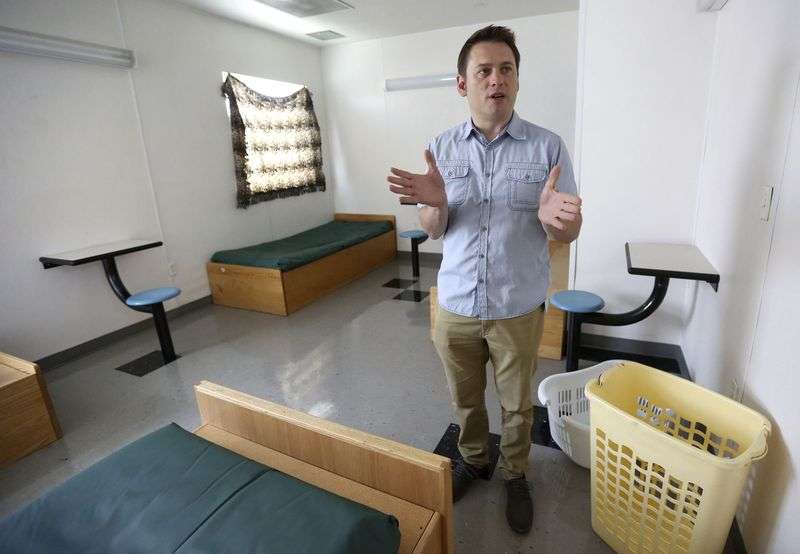 Family therapist Chris Bereshny gives a tour of a bedroom in the Salt Lake County Youth Services Juvenile Receiving Center in South Salt Lake on Friday, Aug. 30, 2019. (Kristin Murphy, KSL)