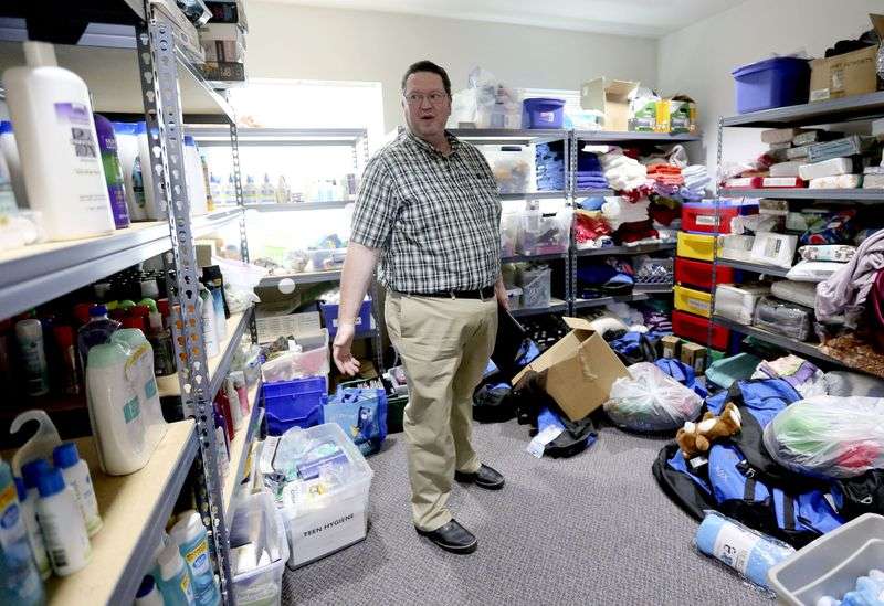 Crisis services program manager JD Green shows where youth can get donated toiletries, clothes and bedding at the Salt Lake County Youth Services Juvenile Receiving Center in South Salt Lake on Friday, Aug. 30, 2019. (Kristin Murphy, KSL)
