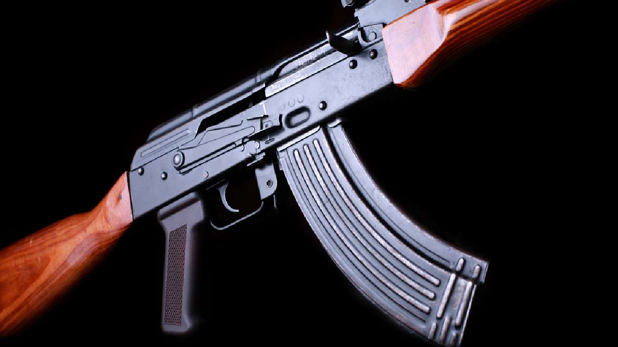 A 35-year-old Magna man was arrested early Wednesday after police say he accidentally shot his friend in the groin with an AK-47.