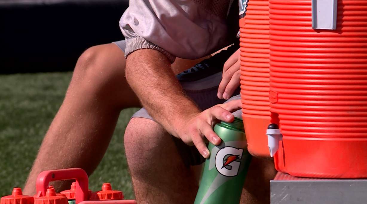 Athletic trainer Mitchell McKay said drinking Gatorade or Powerade can help replenish electrolytes lost through sweat. (Photo: KSL TV)