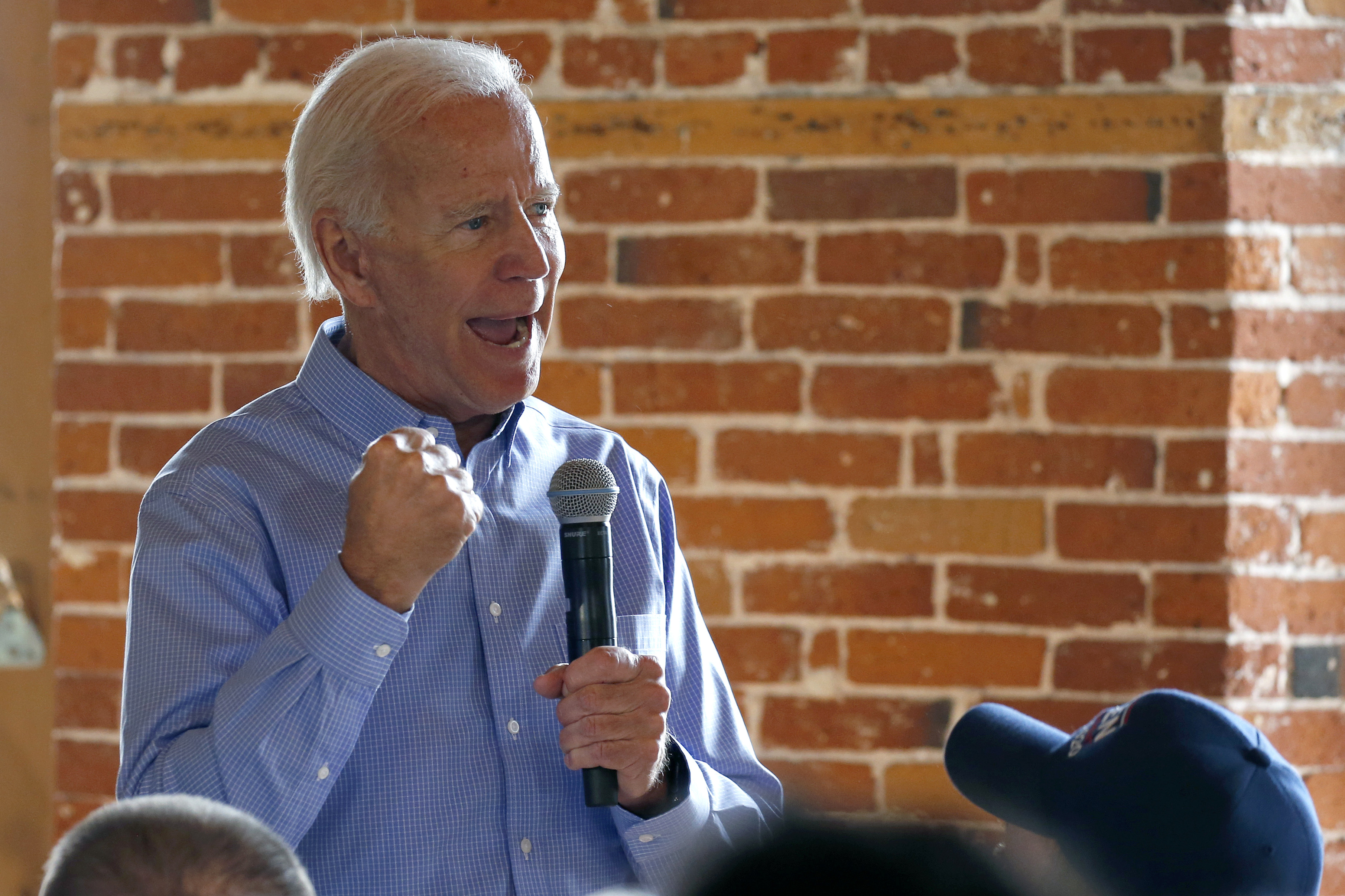 In intimate moment, Biden vows to 'end fossil fuel'