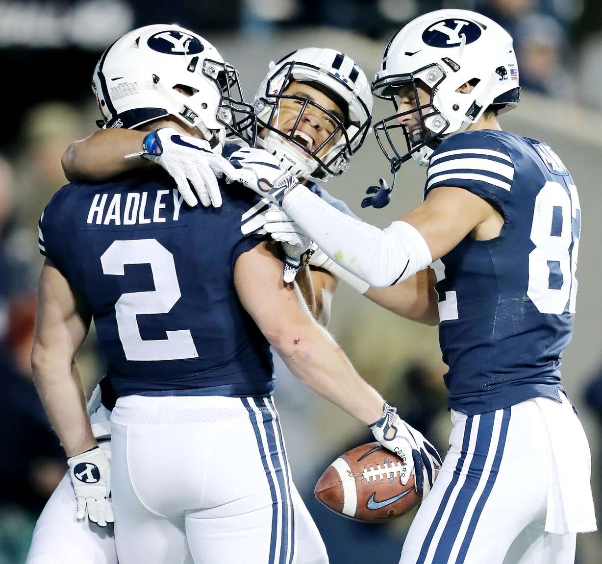 Brigham Young Cougars running back Matt Hadley (2) celebrates a touchdown with wide receiver Neil Pau'u (84) and wide receiver Dax Milne (82) as BYU and Hawaii play at LaVell Edwards Stadium in Provo on Saturday, Oct. 13, 2018. (Photo: Scott G Winterton, KSL)