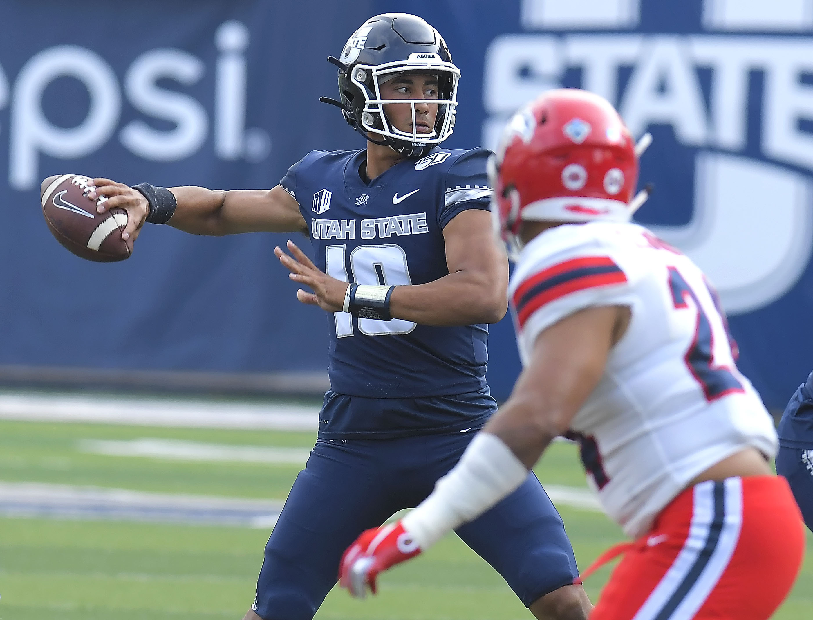 Utah State quarterback Jordan Love (10) throws the ball as Stony Brook linebacker Keirston Johnson (24) defends during an NCAA college football game, Saturday, Sept. 7, 2019, in Logan, Utah. (Photo: Eli Lucero, The Herald Journal via AP)