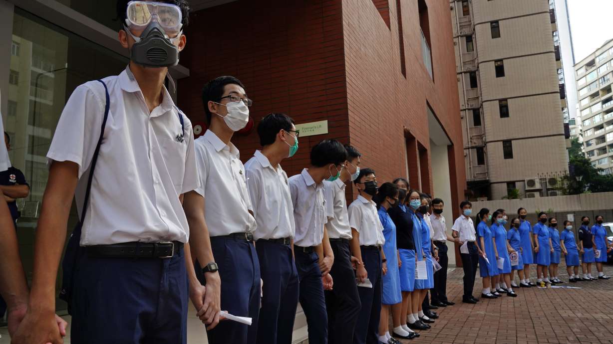 Hong Kong tells US to stay out; students form protest chains