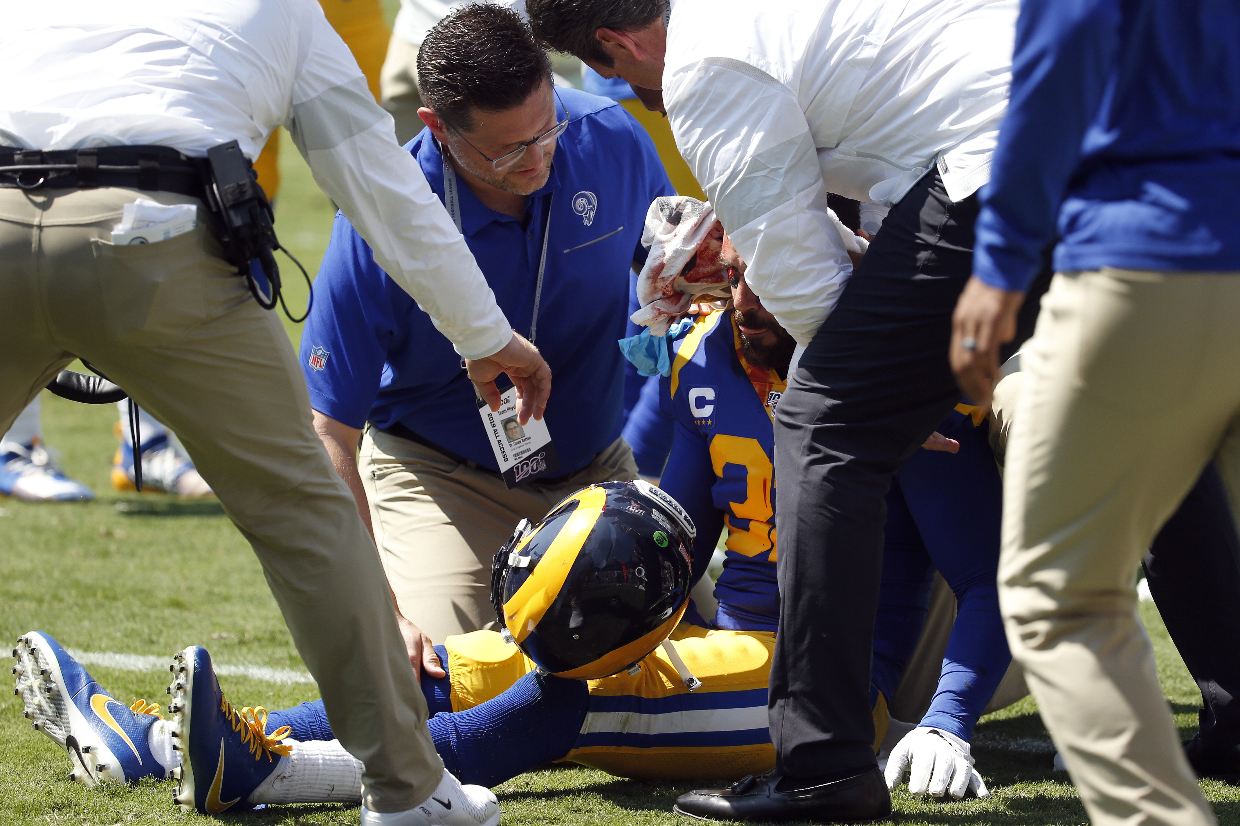 Los Angeles Rams free safety Eric Weddle (32) is attended to following an injury during the first half of an NFL football game against the Carolina Panthers in Charlotte, N.C., Sunday, Sept. 8, 2019. (AP Photo/Brian Blanco)