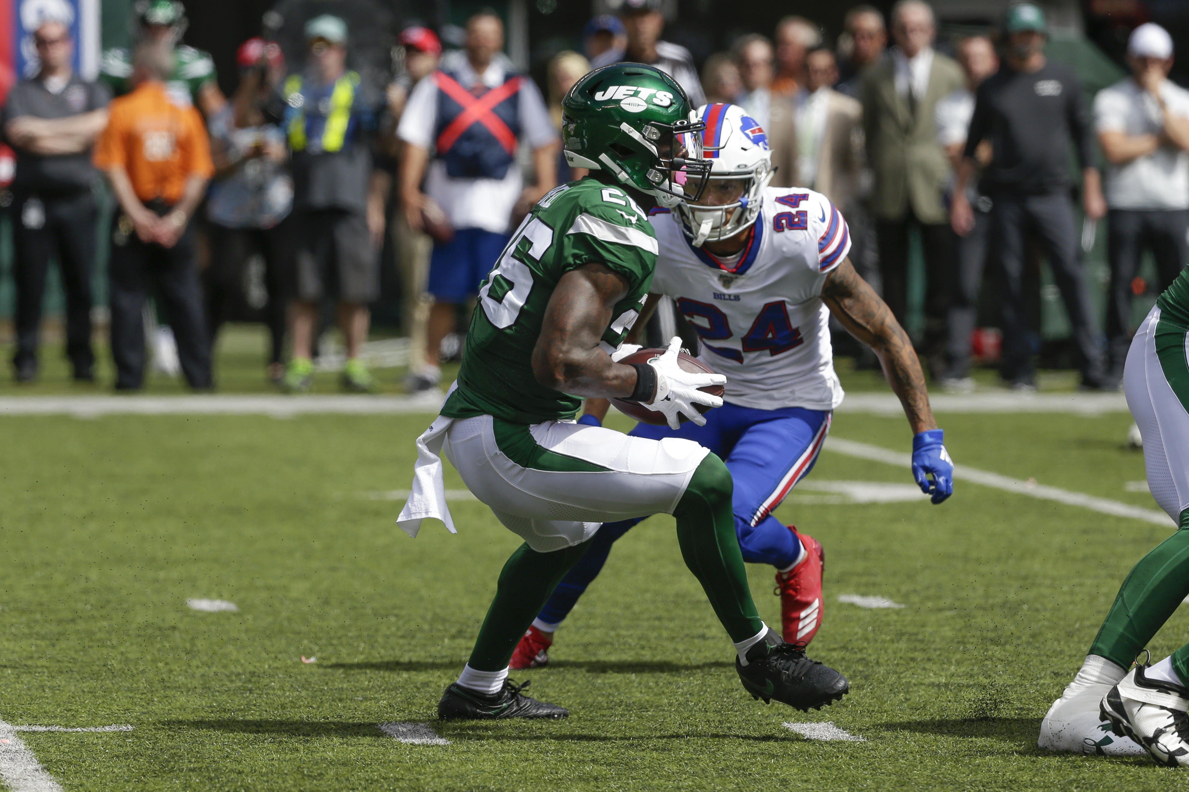 Buffalo Bills' Taron Johnson (24) closes in on New York Jets' Le'Veon Bell (26) during the first half of an NFL football game Sunday, Sept. 8, 2019, in East Rutherford, N.J. (AP Photo/Seth Wenig)