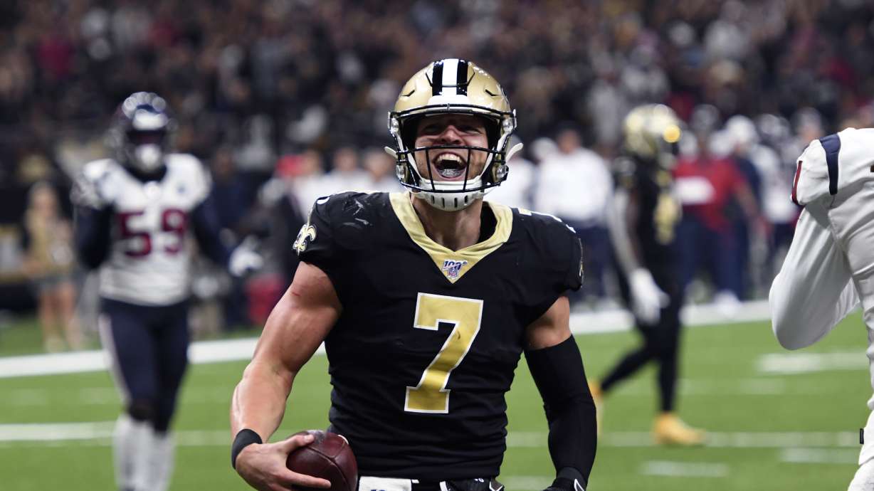 New Orleans Saints quarterback Taysom Hill (7) celebrates his touchdown reception in the second half of an NFL football game against the Houston Texans in New Orleans, Monday, Sept. 9, 2019. (AP Photo/Bill Feig)