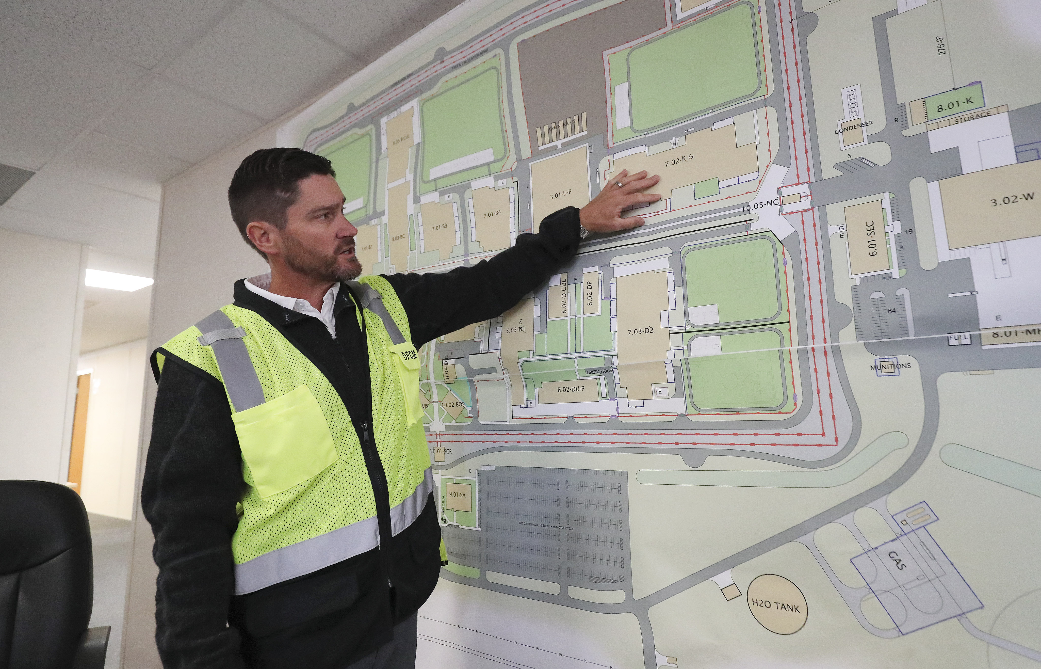 Mike Ambre, assistant director of special projects for the Division of Facilities Construction and Management, shows plans for the new state prison in Salt Lake City on Wednesday, Sept. 11, 2019. (Jeffrey Allred, kSL)