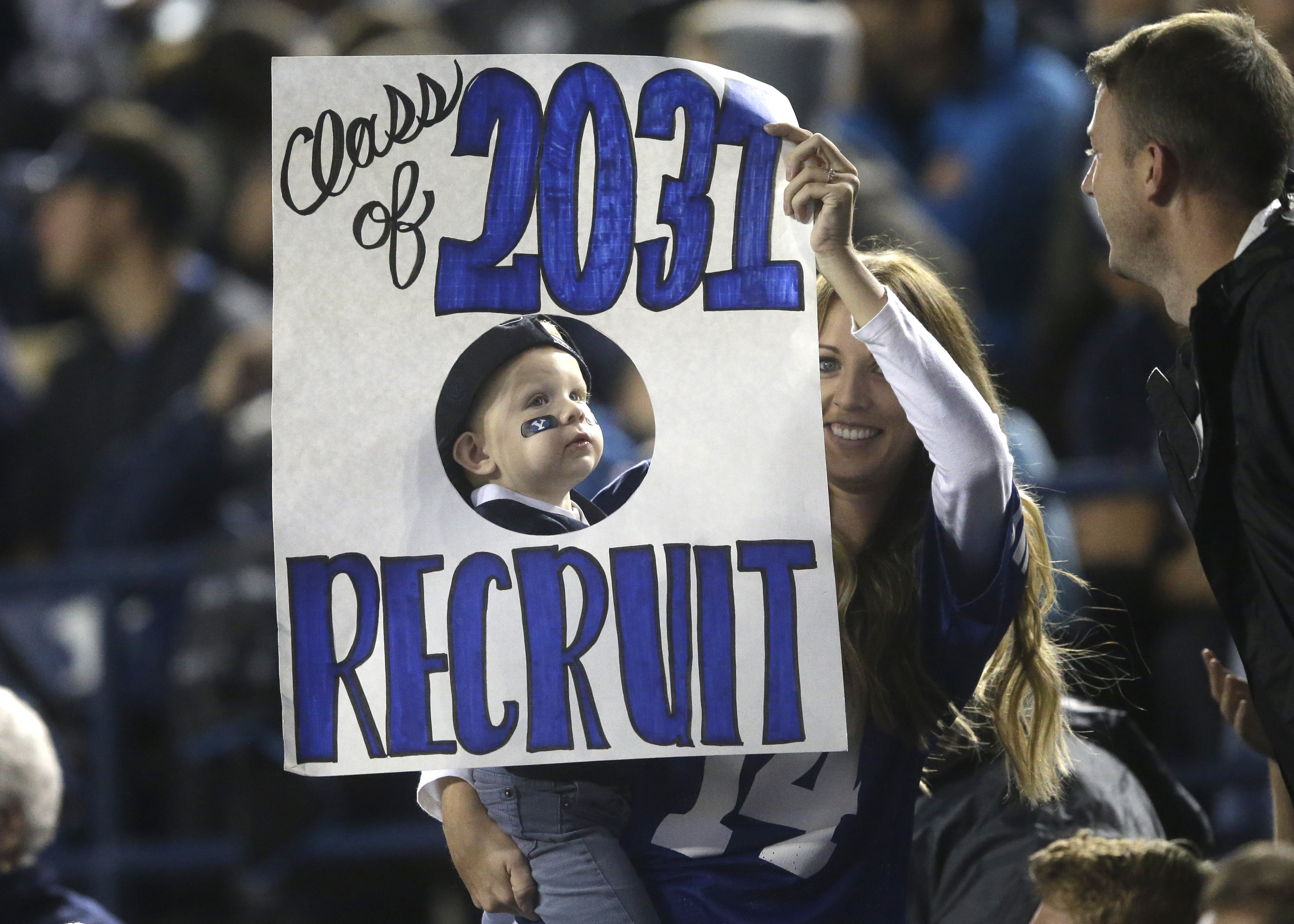FILE - BYU fans show their support in the first half during an NCAA college football game against Connecticut Friday, Oct. 2, 2015, in Provo, Utah. (AP Photo/Rick Bowmer)