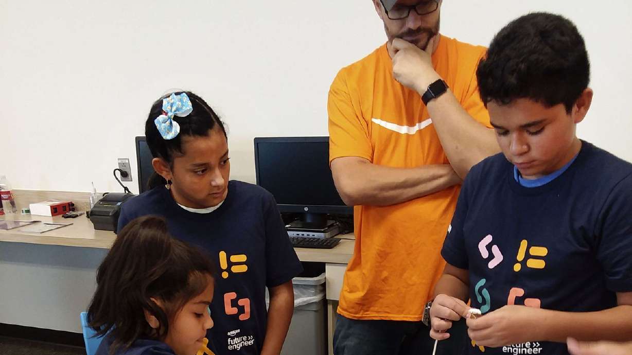 Utah students get a chance to tour Amazon facility, play with robotics