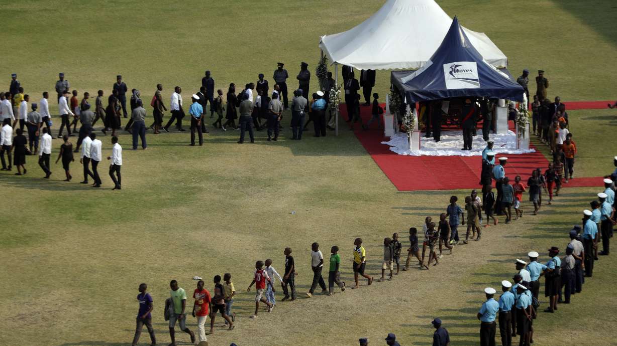 Zimbabwe's Mugabe honored at state funeral, burial delayed