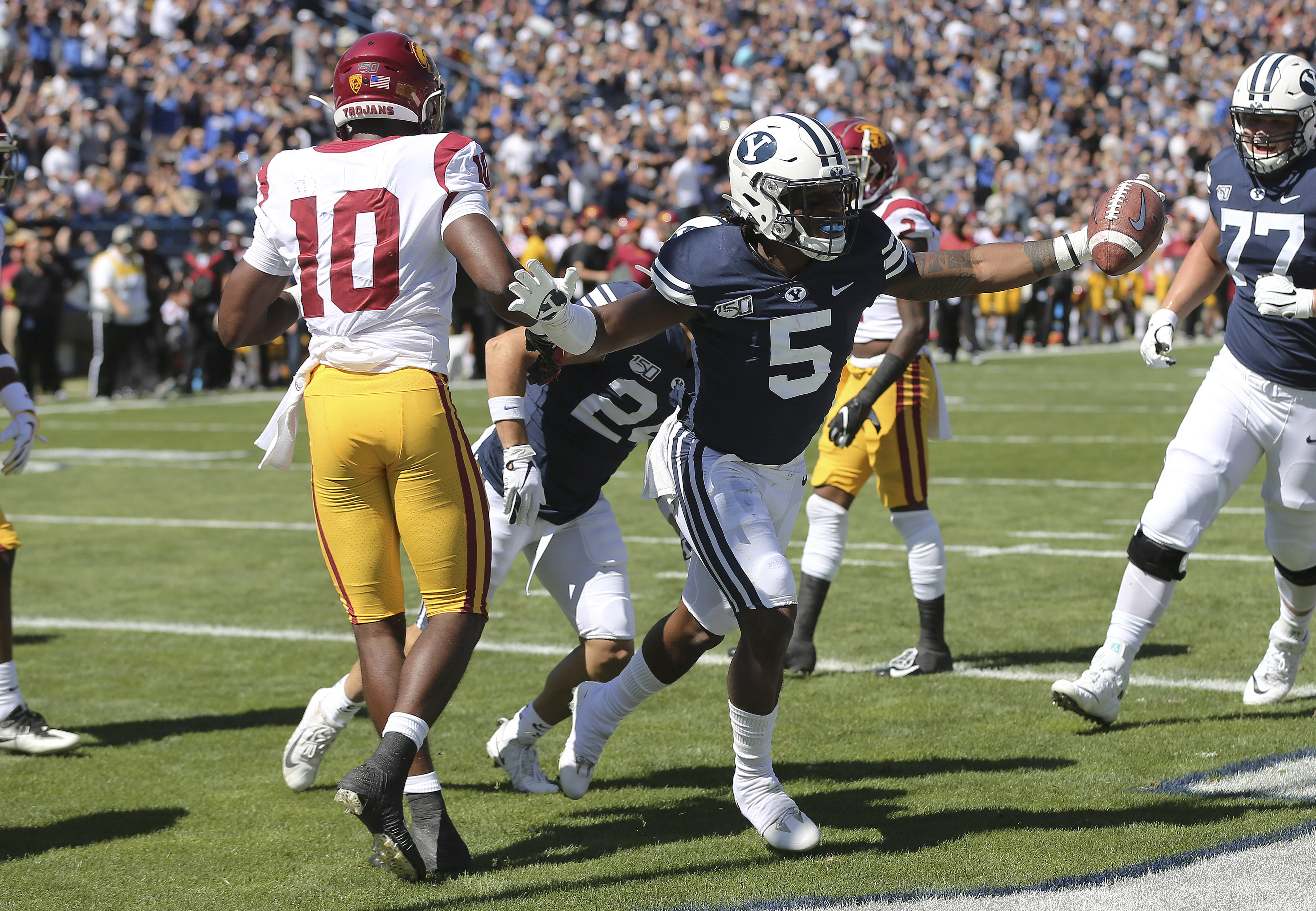 Brigham Young Cougars defensive back Dayan Ghanwoloku (5) celebrate his touchdown against the USC Trojans in Provo on Saturday, Sept. 14, 2019. (Photo: Jeffrey D. Allred, KSL)