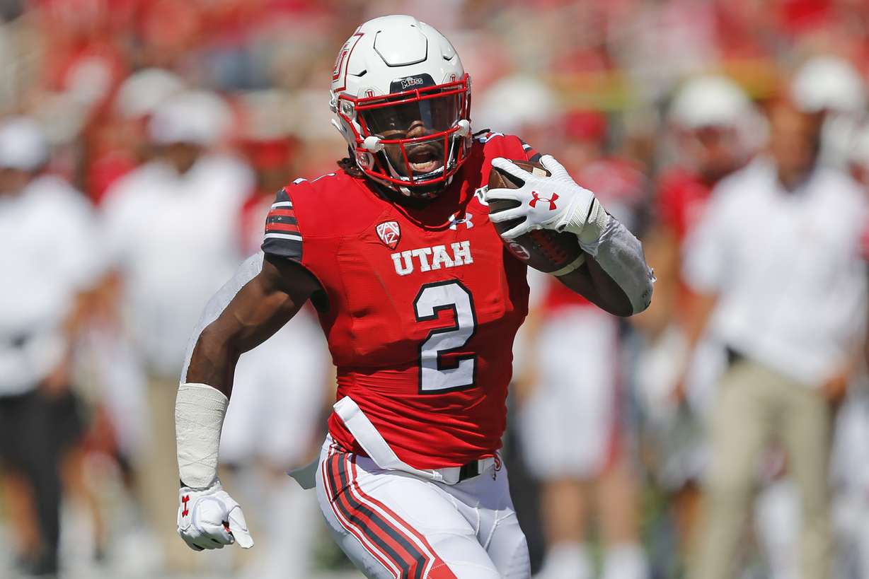 Utah running back Zack Moss (2) carries the ball against Idaho State in the first half of an NCAA college football game Saturday, Sept. 14, 2019, in Salt Lake City. (Rick Bowmer, AP Photo)