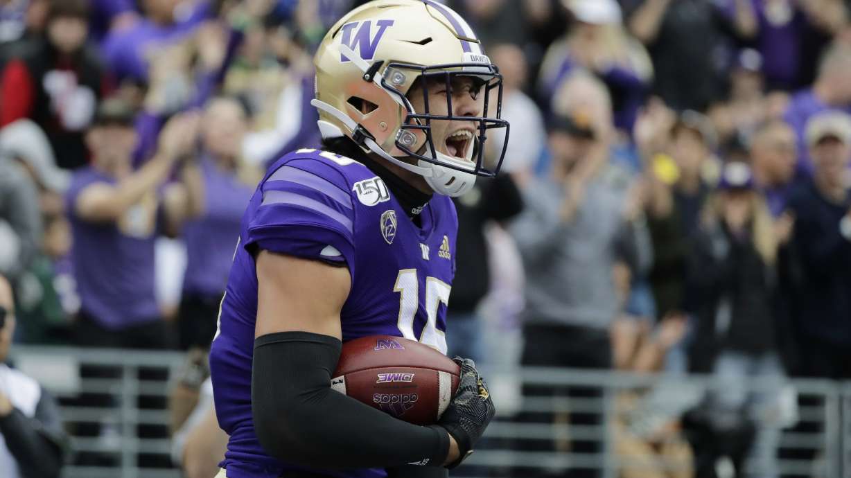 Washington wide receiver Puka Nacua celebrates after catching a pass for a touchdown against Hawaii during the first half of an NCAA college football game, Saturday, Sept. 14, 2019, in Seattle. (AP Photo/Ted S. Warren)