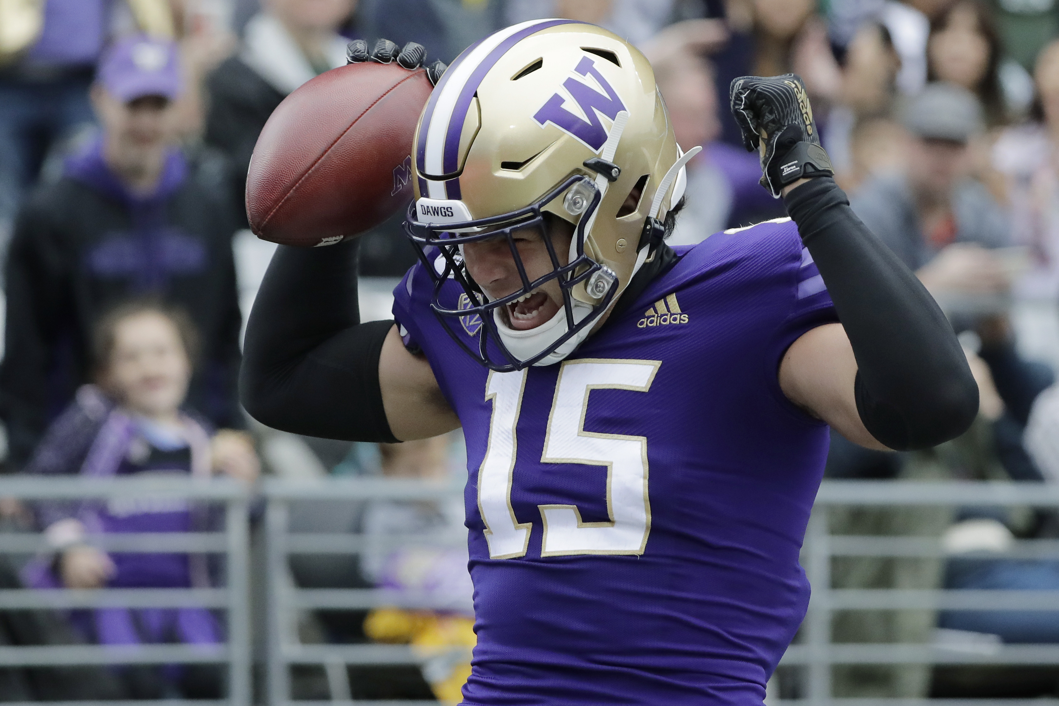 Washington wide receiver Puka Nacua celebrates after catching a pass for a touchdown against Hawaii during the first half of an NCAA college football game, Sept. 14, 2019, in Seattle.