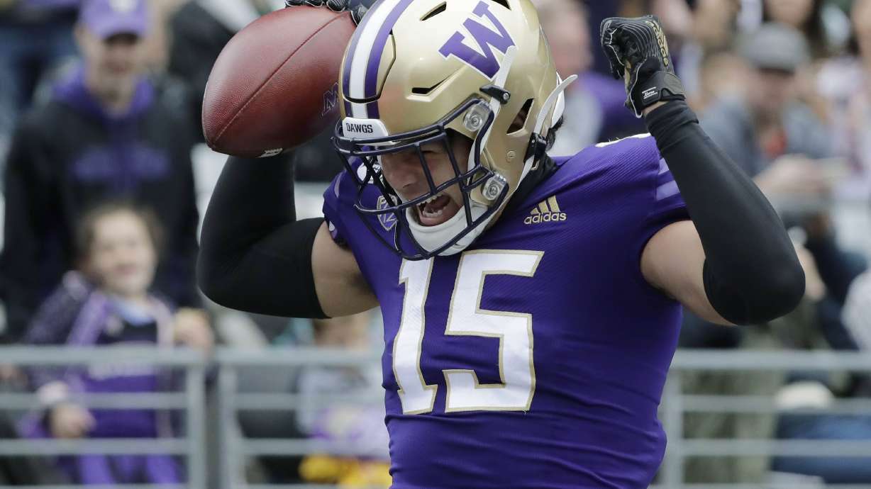 Washington wide receiver Puka Nacua celebrates after catching a pass for a touchdown against Hawaii during the first half of an NCAA college football game, Saturday, Sept. 14, 2019, in Seattle. (AP Photo/Ted S. Warren)