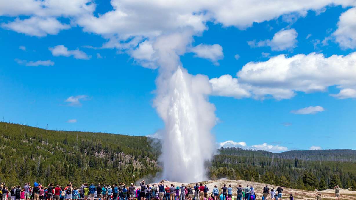 Men face charges for walking on Old Faithful Geyser