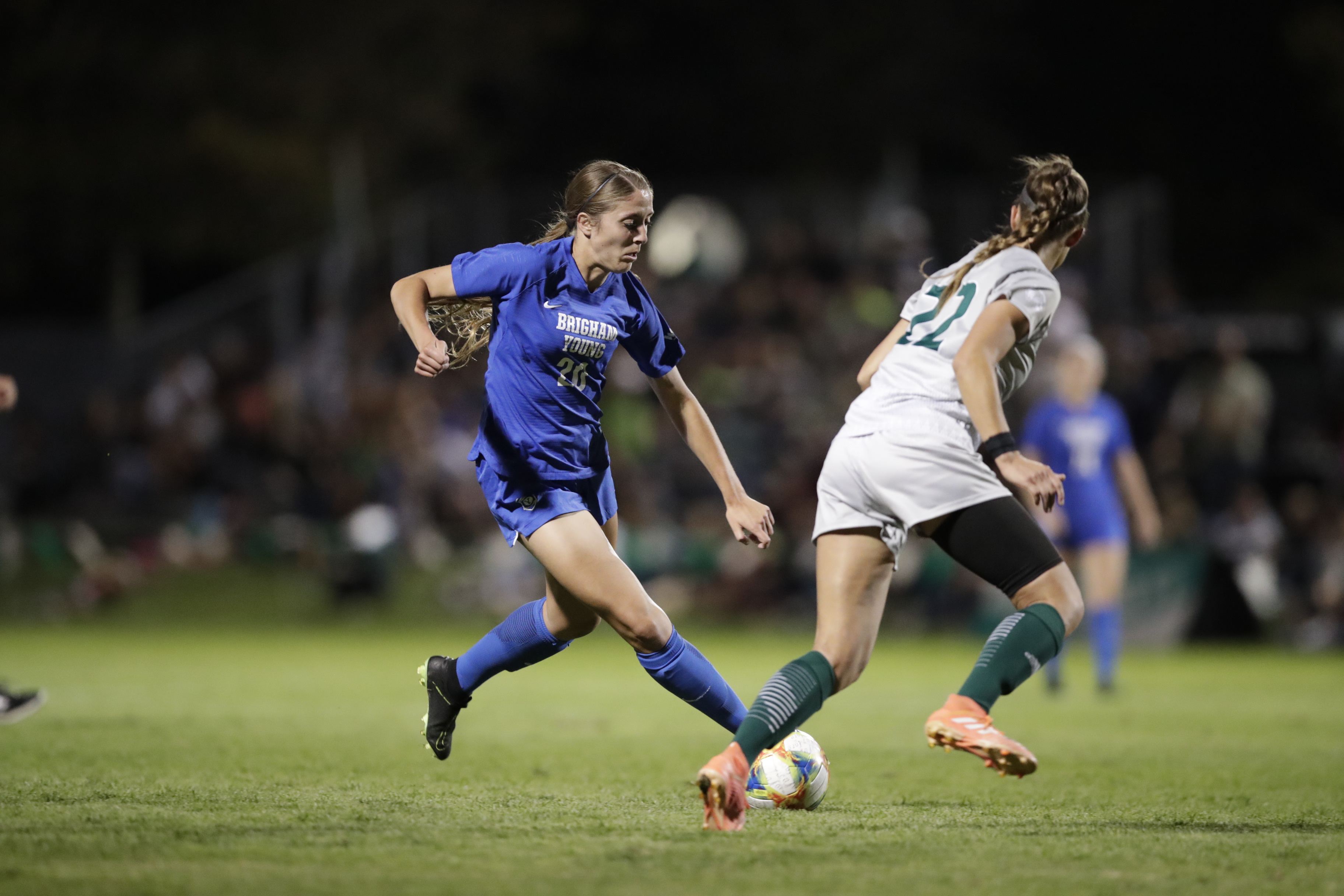 BYU forward Camerton Tucker drives past a UVU defender as No. 10 BYU women's soccer edges crosstown rival Utah Valley, 1-0, Monday, Sept. 16, 2018 at Clyde Field in Orem. (Photo: Nate Edwards, BYU Photo)