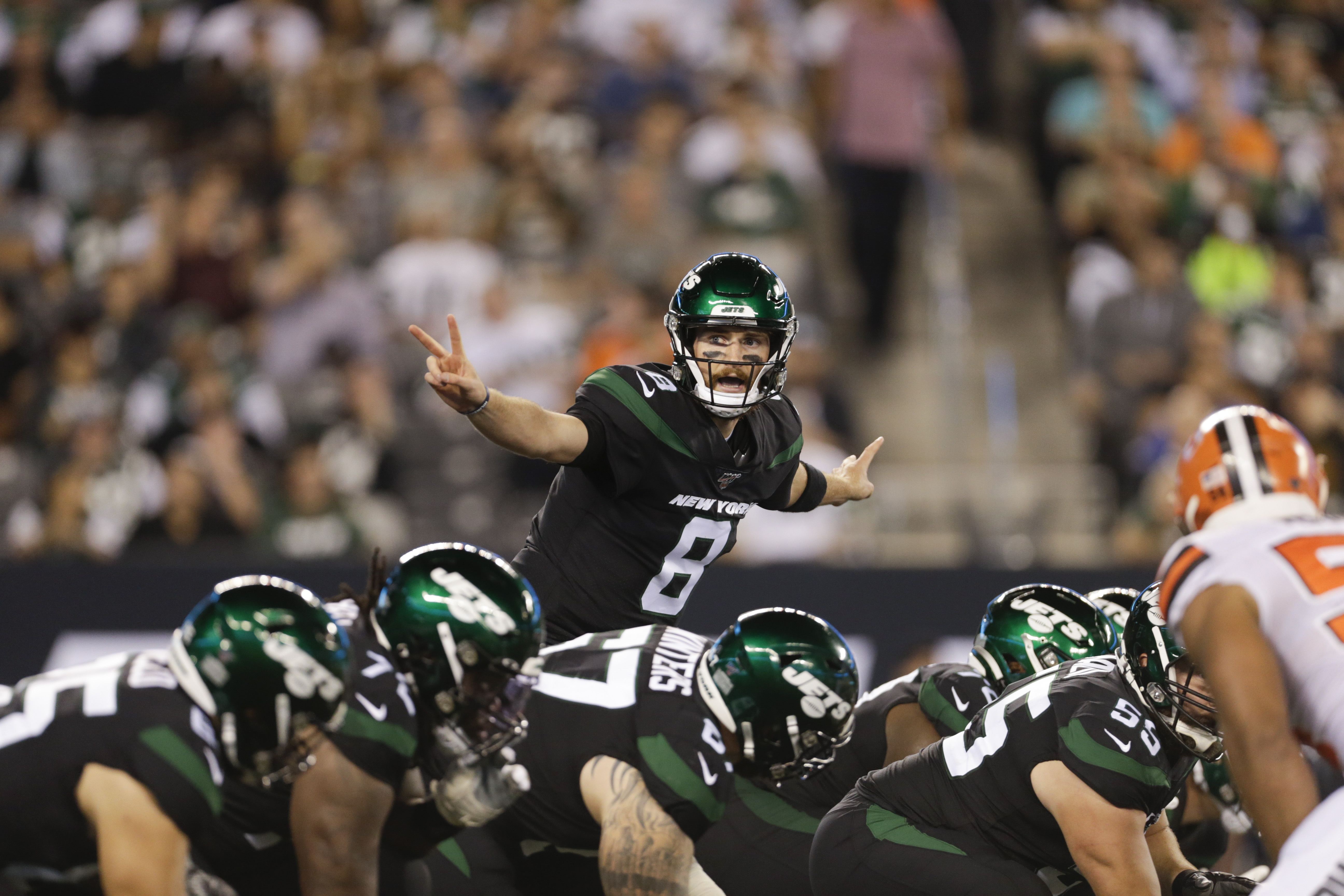 New York Jets' quarterback Luke Falk calls out to his teammates during the second half of an NFL football game against the Cleveland Browns Monday, Sept. 16, 2019, in East Rutherford, N.J. (AP Photo/Adam Hunger)