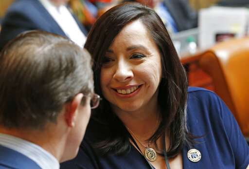 Rep. Angela Romero, D-Salt Lake City, speaks with Rep. Ken Ivory, R-West Jordan, on the House floor Tuesday, Feb. 26, 2019, in Salt Lake City. (AP Photo/Rick Bowmer)