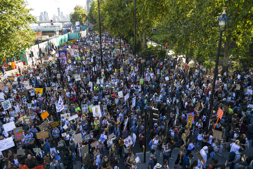 Climate protesters demonstrate in London, Friday, Sept. 20, 2019. In Canberra and Kabul, Cape Town and Berlin, and across the globe, hundreds of thousands of people took the streets Friday to demand that leaders tackle climate change in the run-up to a U.N. summit. (AP Photo/Alberto Pezzali)