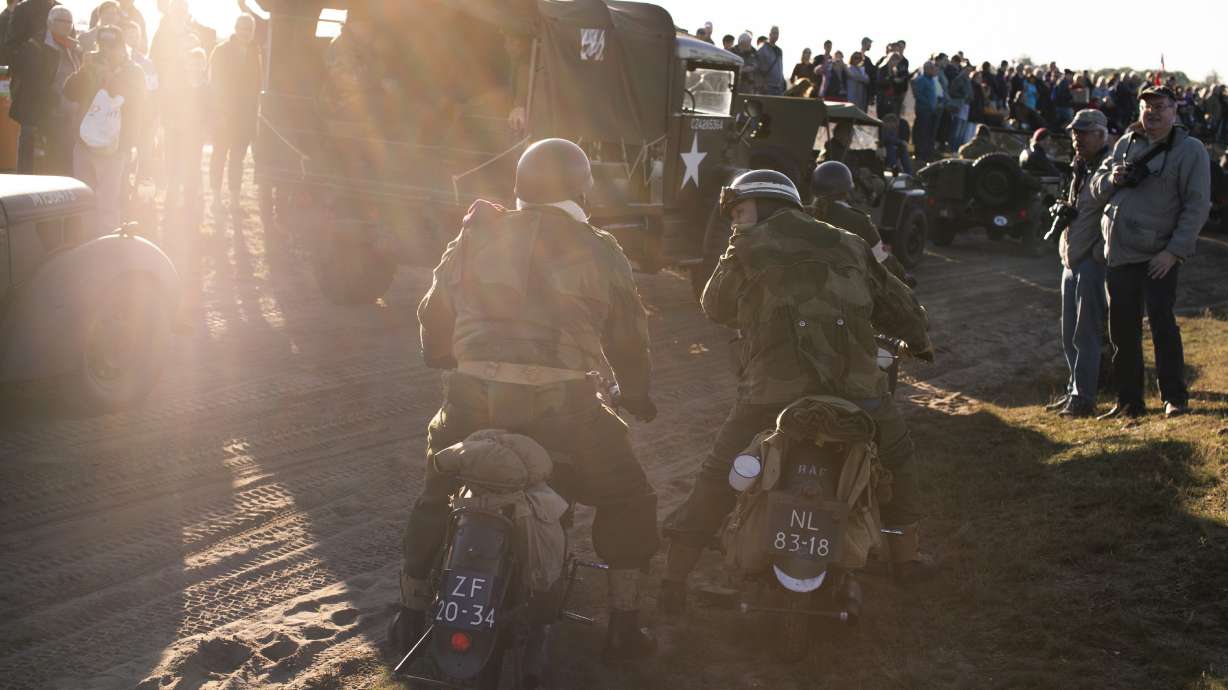 Parachutists jump over Dutch heath to mark WWII operation