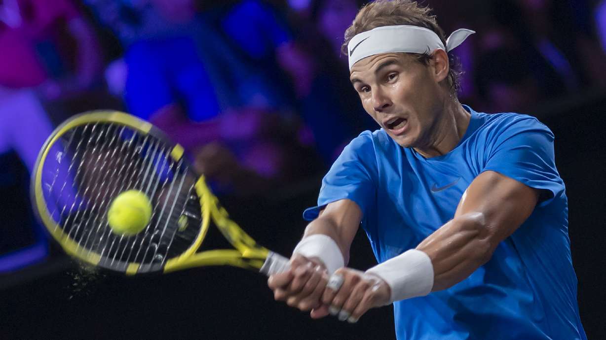 Federer wins with a little help from friends Nadal and Borg