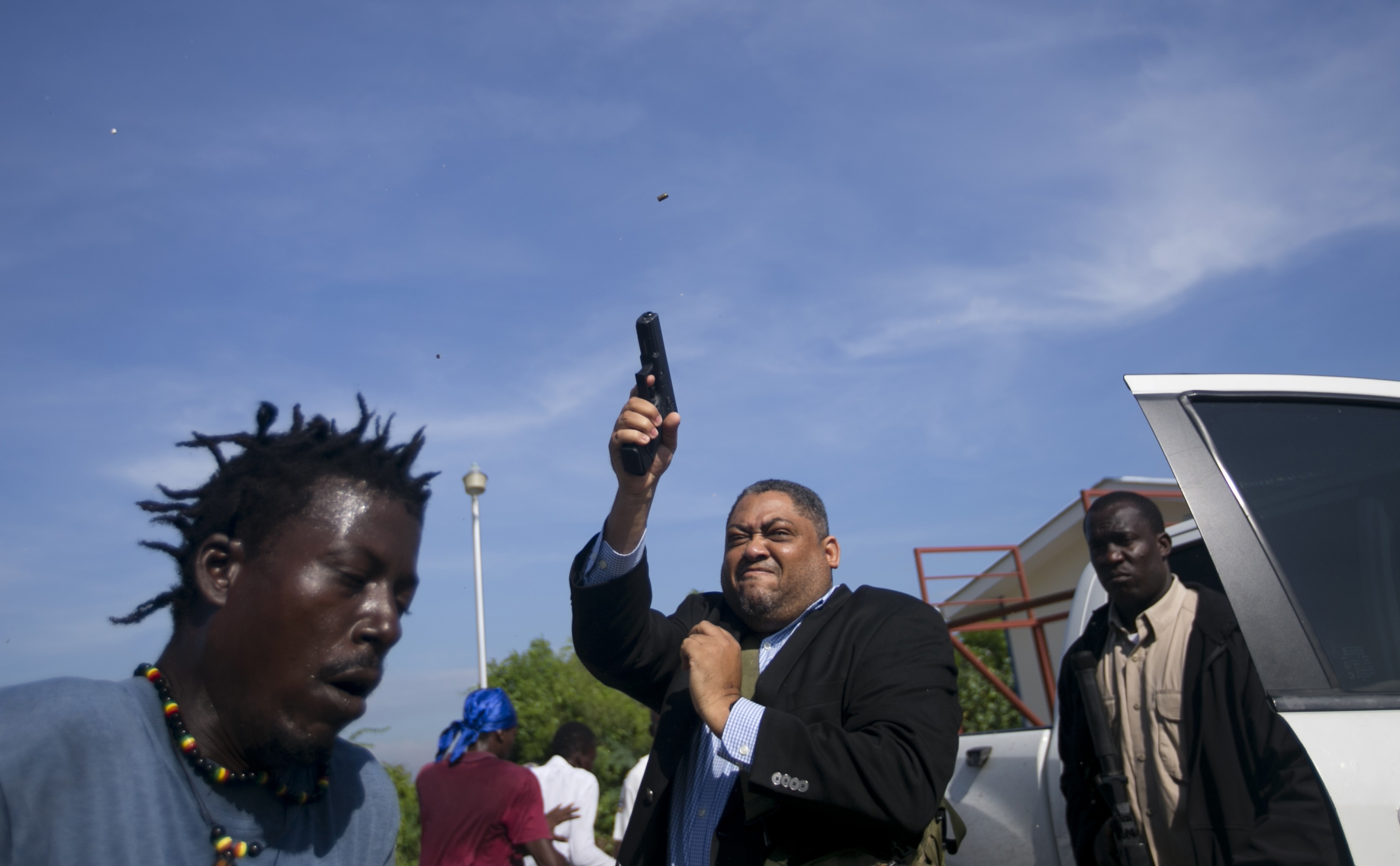 AP photographer wounded as senator fires gun during protest