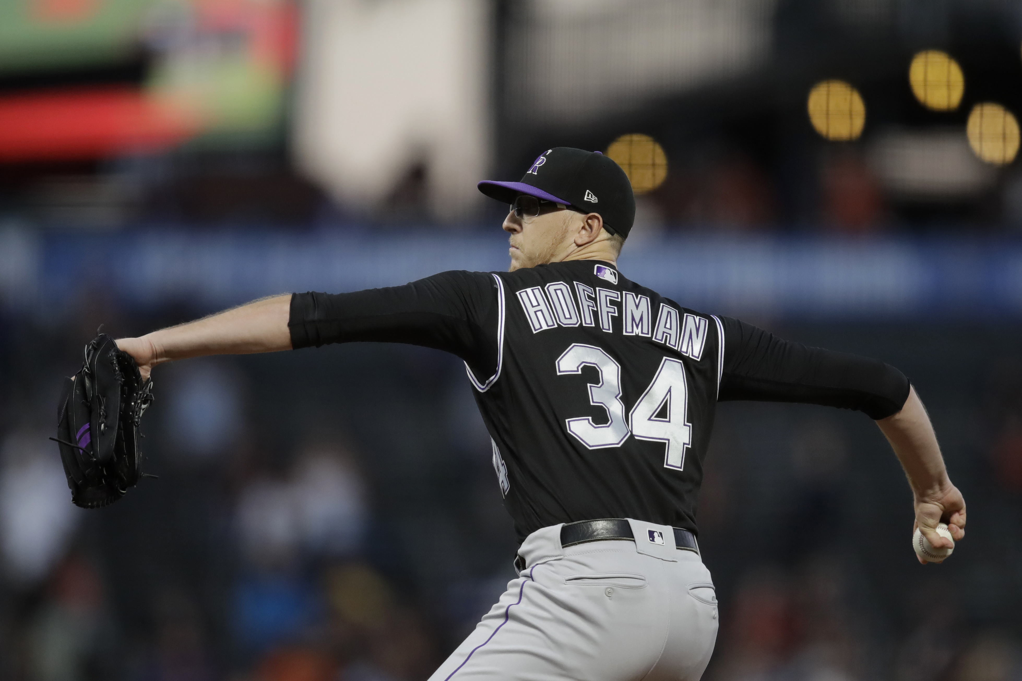 Rockies RH Hoffman carted off field after line drive to knee