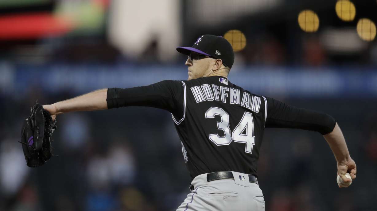 Rockies RH Hoffman carted off field after line drive to knee