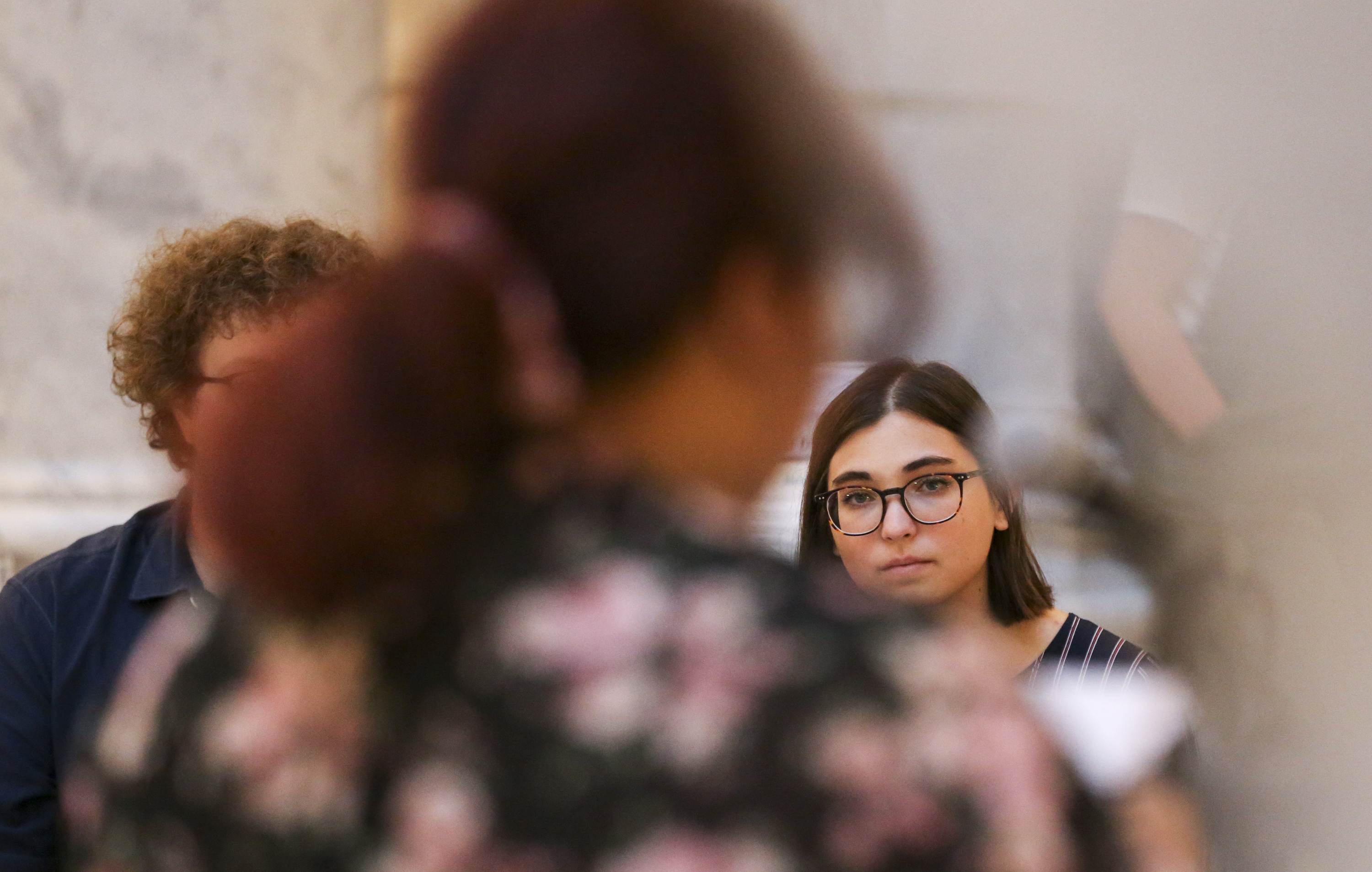 Athena Schwartz listens to a suicide survivor share her story during a vigil for people who have died by suicide in the Capitol Rotunda in Salt Lake City on Thursday, Sept. 26, 2019. The Youth of Utah Advocacy Coalition hosted the event. (Photo: Colter Peterson, KSL)
