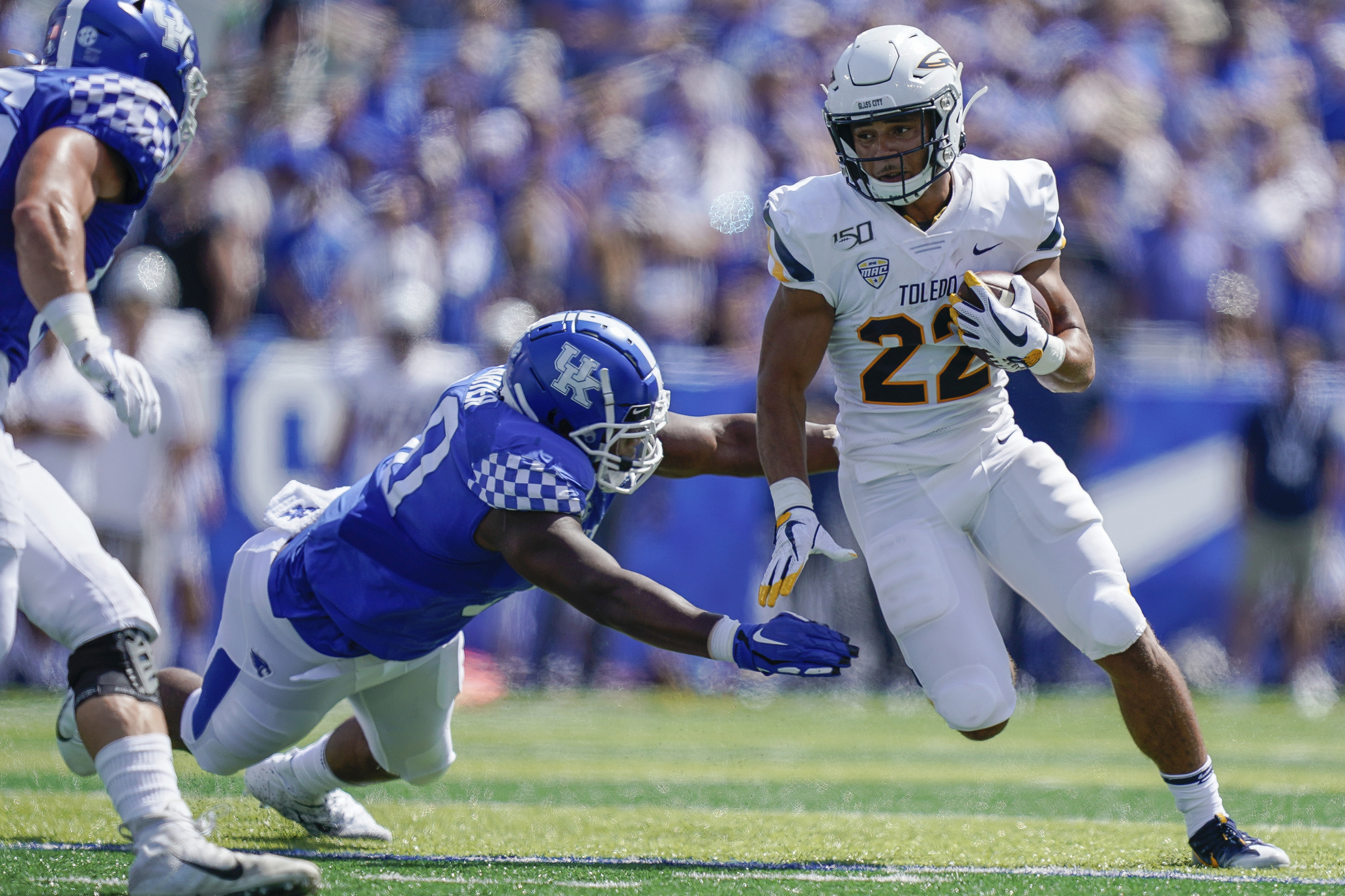 Toledo running back Bryant Koback (22) runs with the ball during an NCAA college football game, Saturday, Aug. 31, 2019, in Lexington, Ky. (AP Photo/Bryan Woolston)