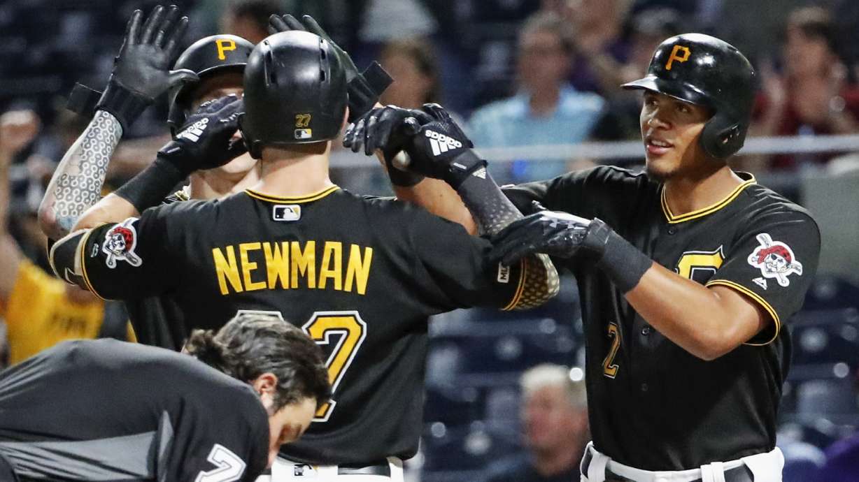 Newman homers twice as Pirates rally past Reds 6-5