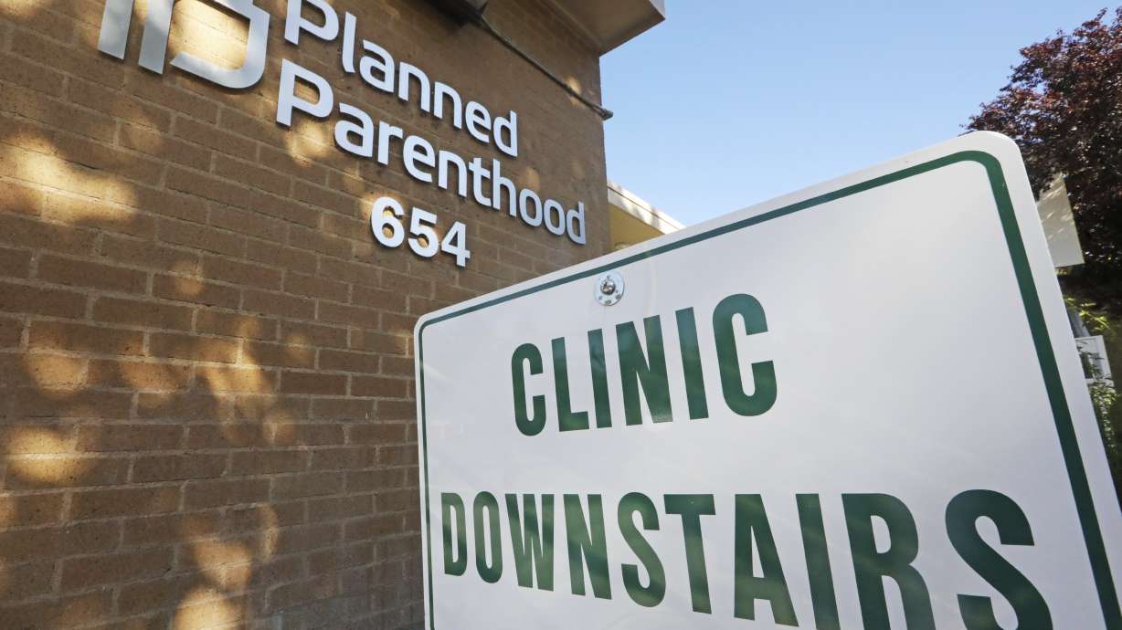 A sign is displayed at Planned Parenthood of Utah in Salt Lake City. Planned Parenthood Association of Utah said it will be rejoining Title X federal planning program after the reversal of a 2019 Trump administration rule.