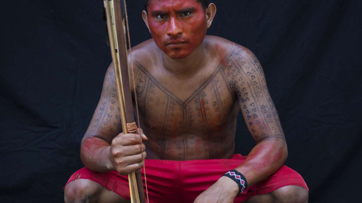 AP PHOTOS: Amazon's Tembe paint bodies for rituals and war