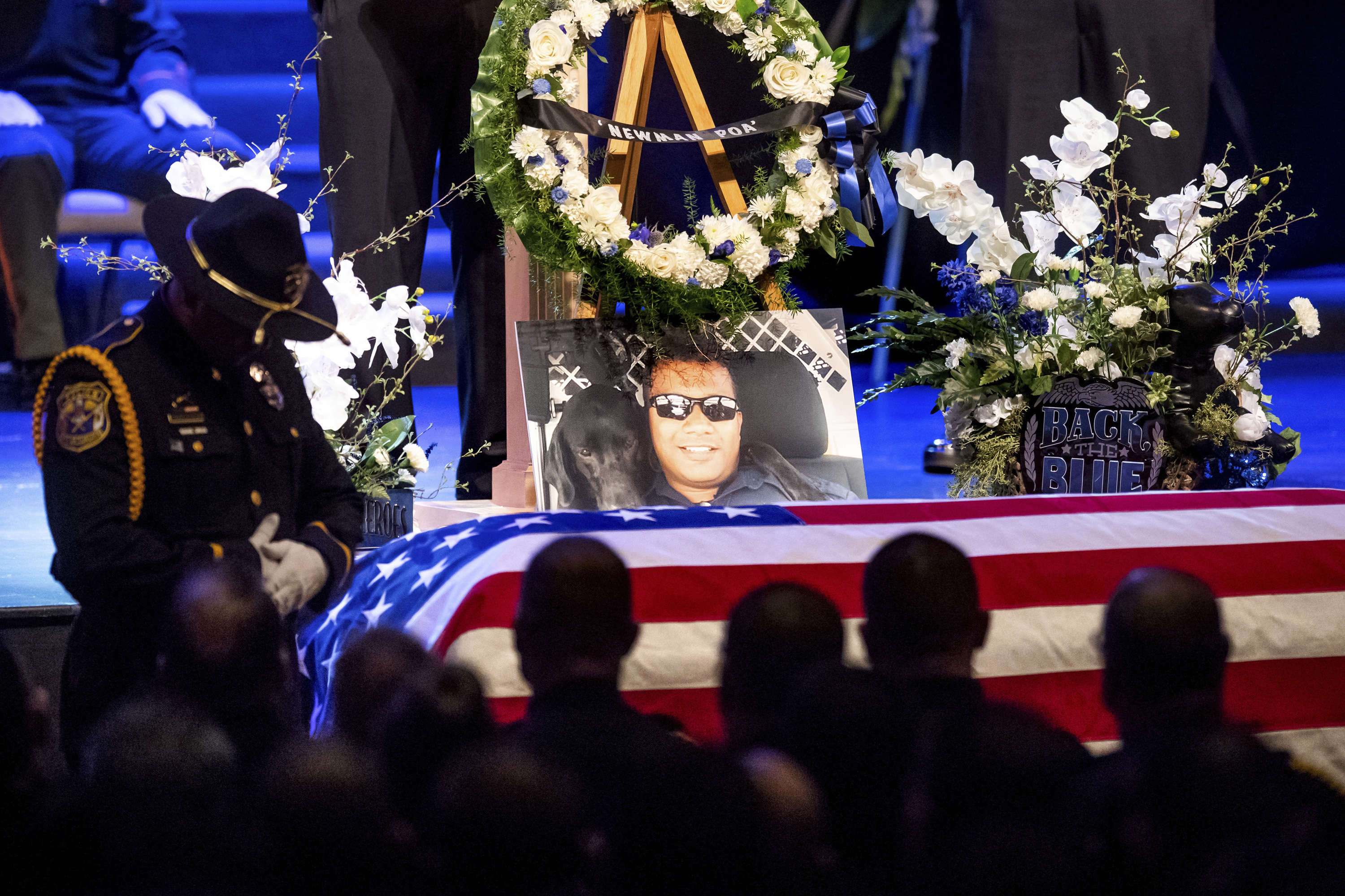 2 guilty of aiding man accused of killing California officer