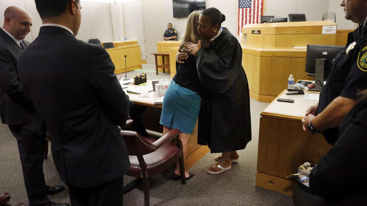 Slain man’s brother, judge hug ex-cop sentenced to 10 years