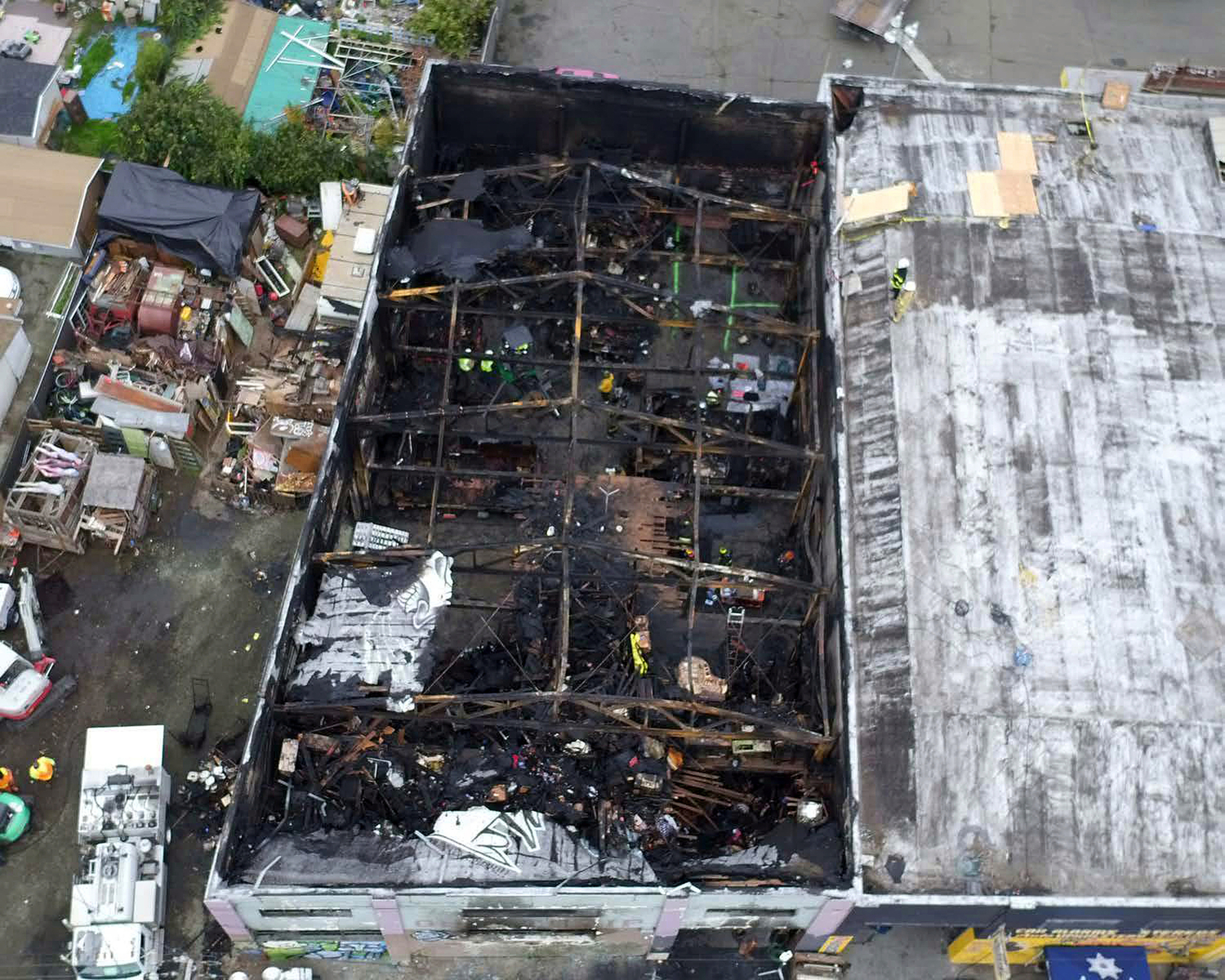 The Latest: 2 jurors held in contempt for warehouse trial