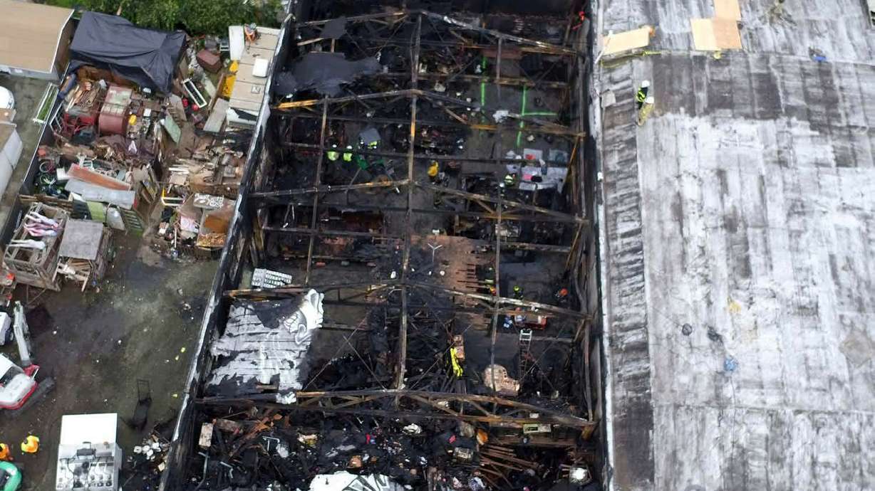 The Latest: 2 jurors held in contempt for warehouse trial
