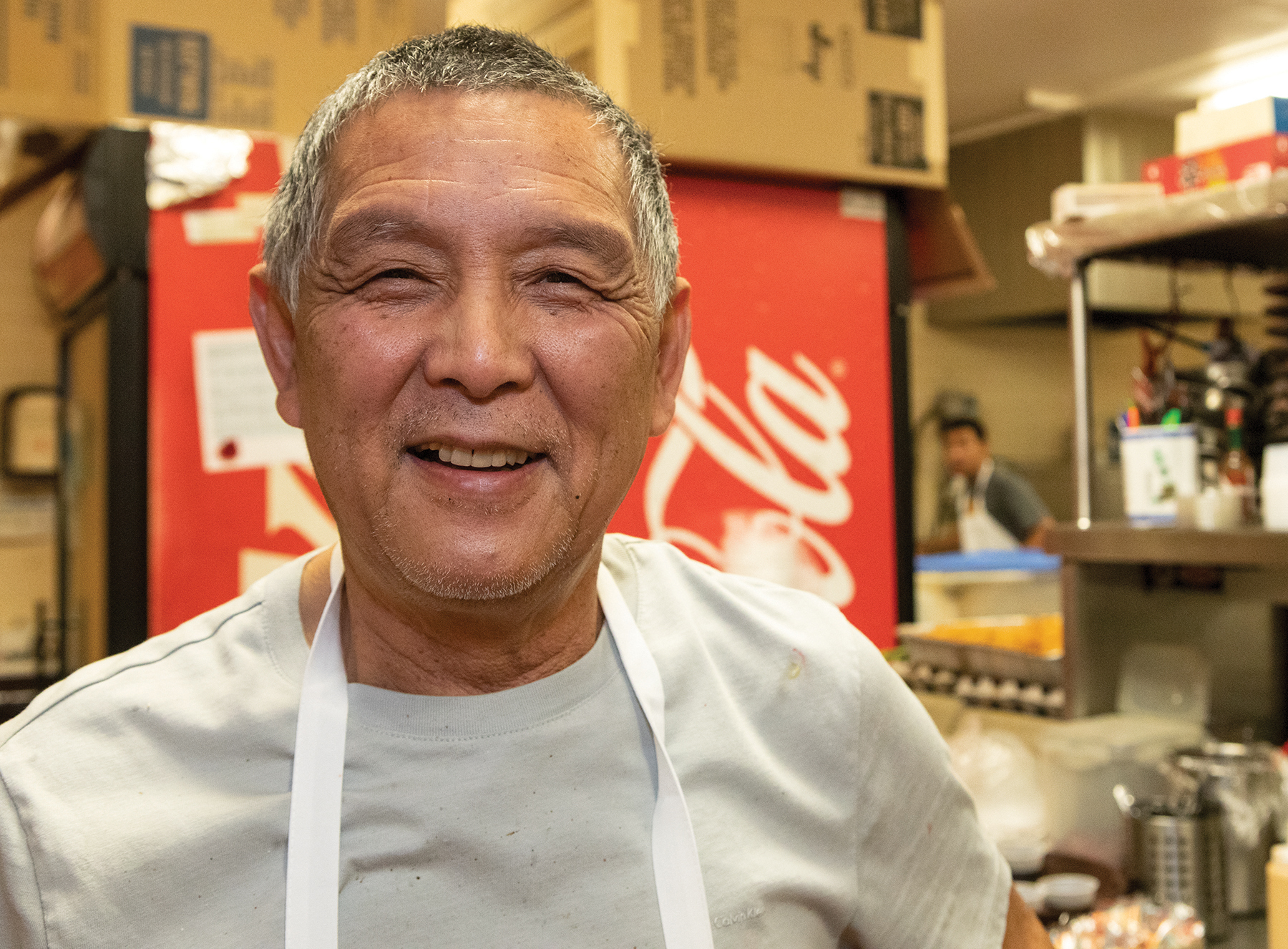 Eddy Leo smiles in his kitchen at the Sun Lok Yuen restaurant in Tooele. (Photo: Francie Aufdemorte, Tooele Transcript Bulletin)