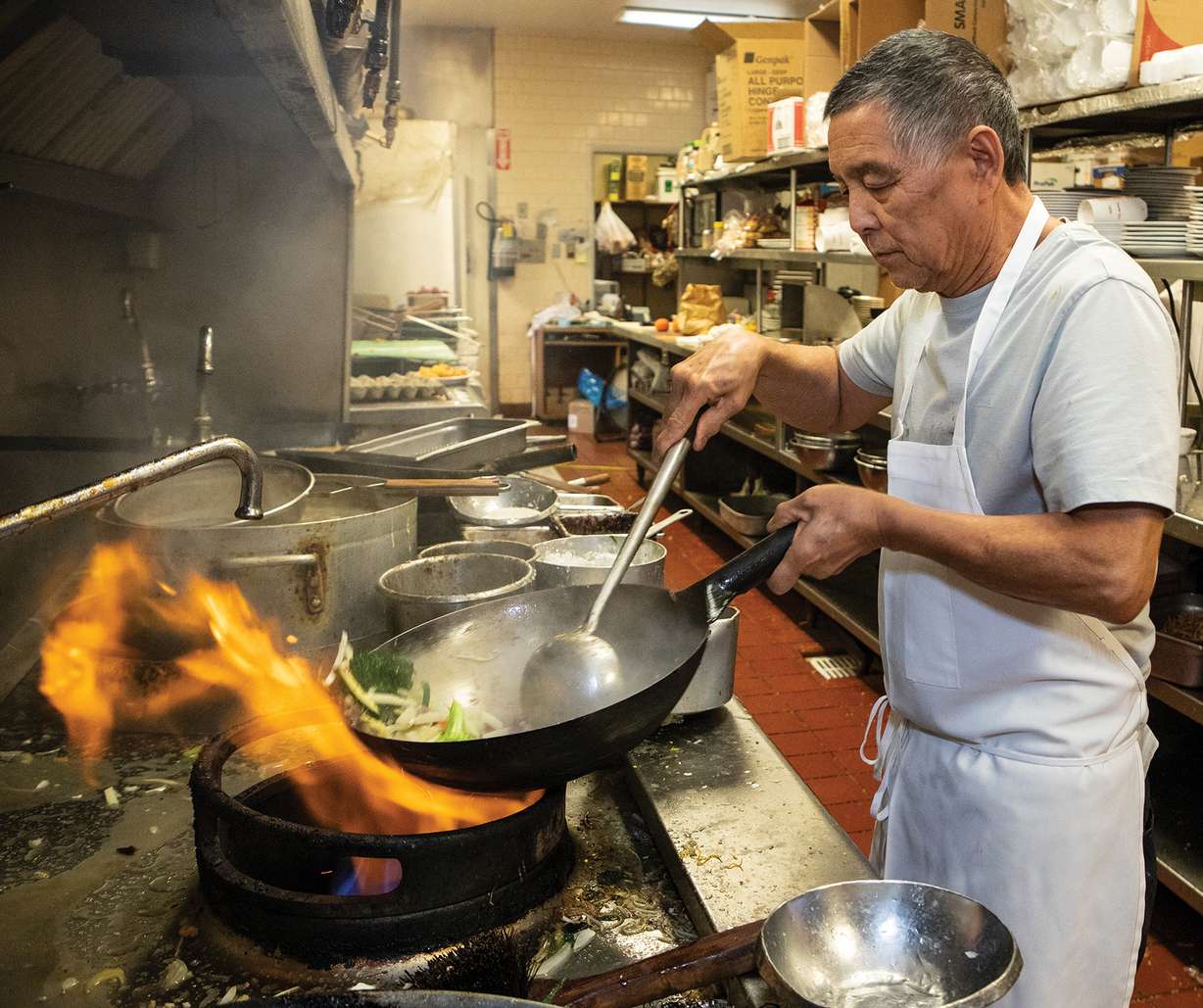 Eddy Leo cooks in his kitchen at the Sun Lok Yuen restaurant in Tooele. (Photo: Francie Aufdemorte, Tooele Transcript Bulletin)