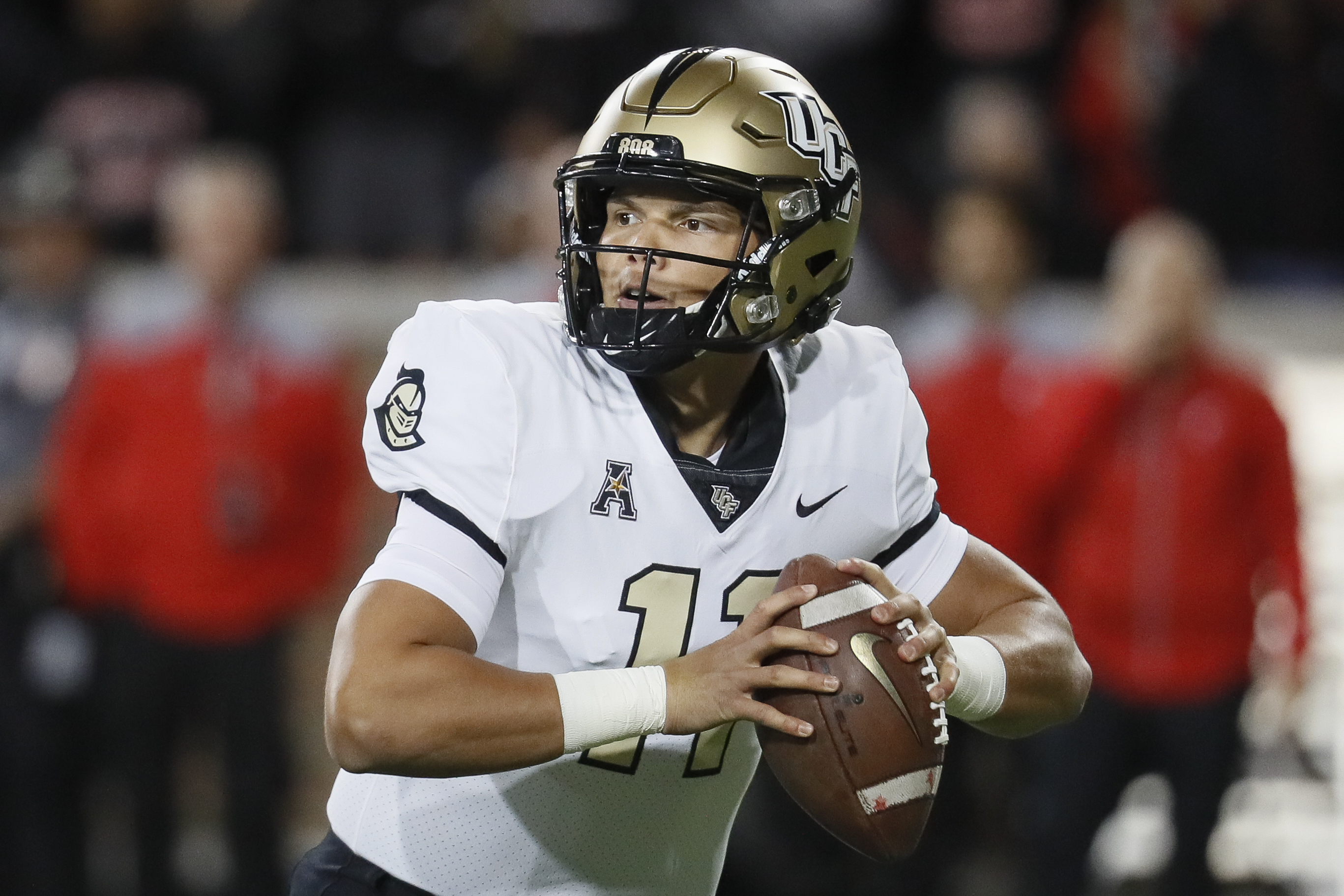 UCF quarterback Dillon Gabriel looks to pass during the first half of the team's NCAA college football game against Cincinnati, Friday, Oct. 4, 2019, in Cincinnati.