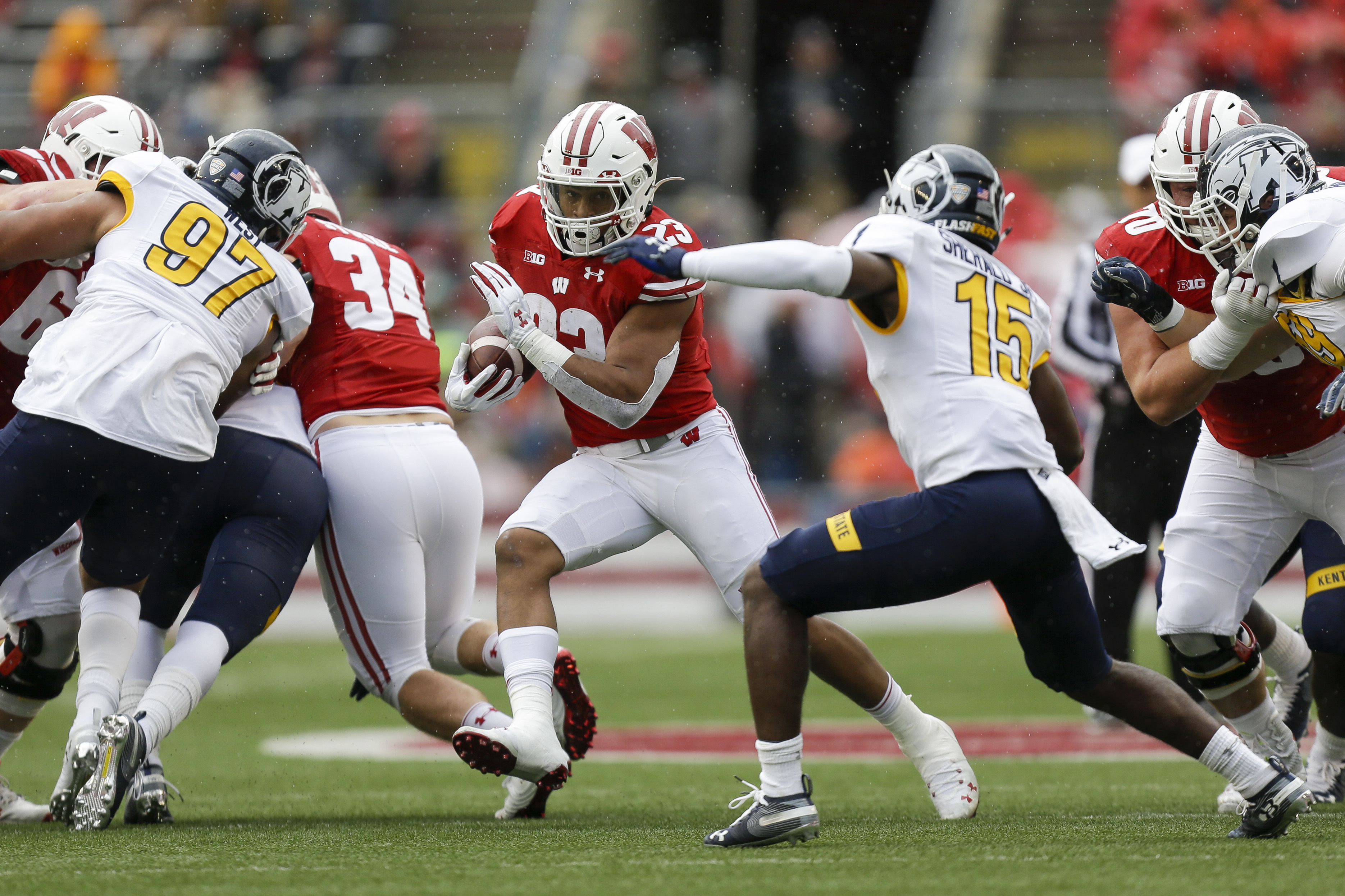 Taylor scores 5 TDs to lead No. 8 Wisconsin past Kent State