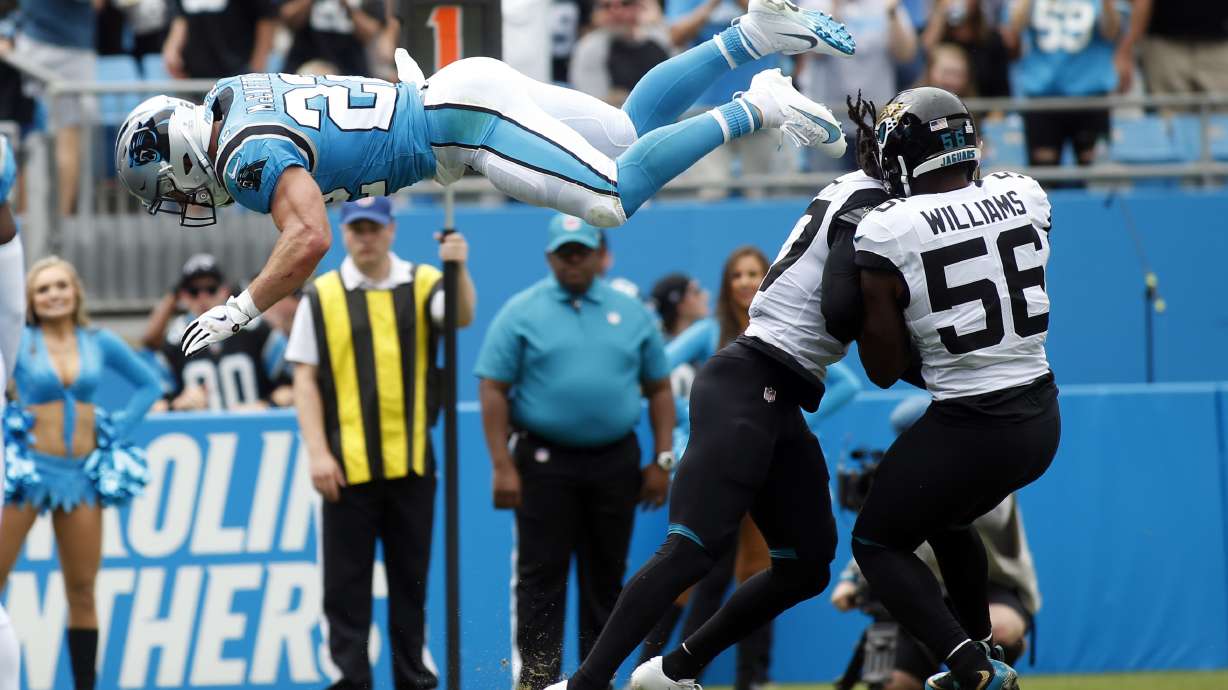 McCaffrey scores 3 TDs, Panthers hold off Jaguars 34-27