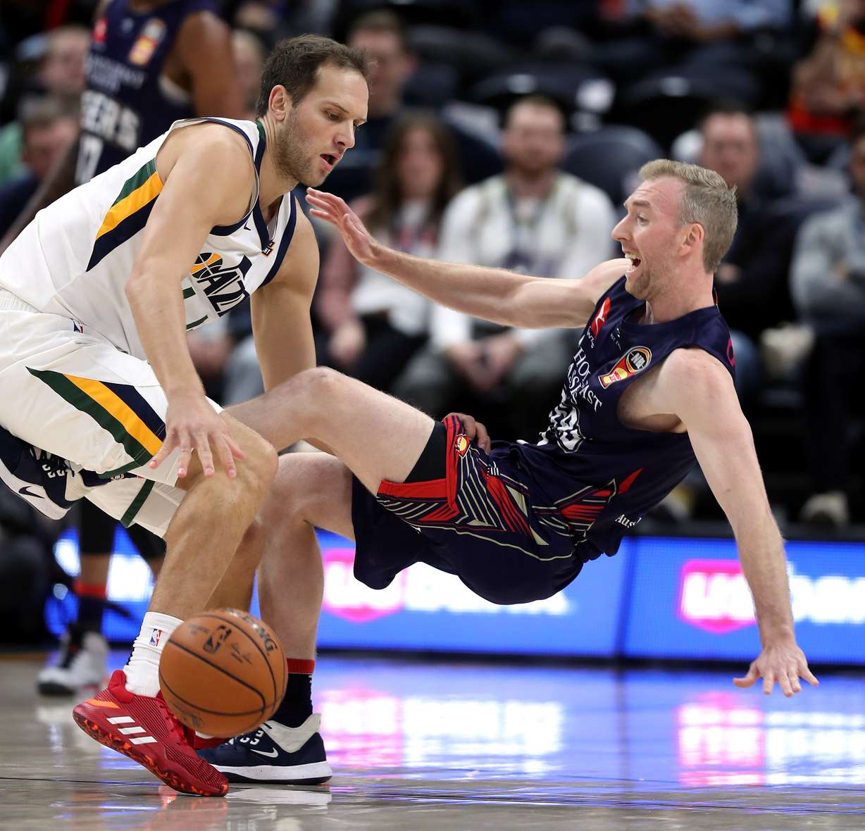 Utah Jazz forward Bojan Bogdanovic (44) and Adelaide 36ers guard Brendan Teys (7) collide as the Utah Jazz and the Adelaide 36ers play at Vivint Arena in Salt Lake City on Saturday, Oct. 5, 2019. (Scott G Winterton, KSL)